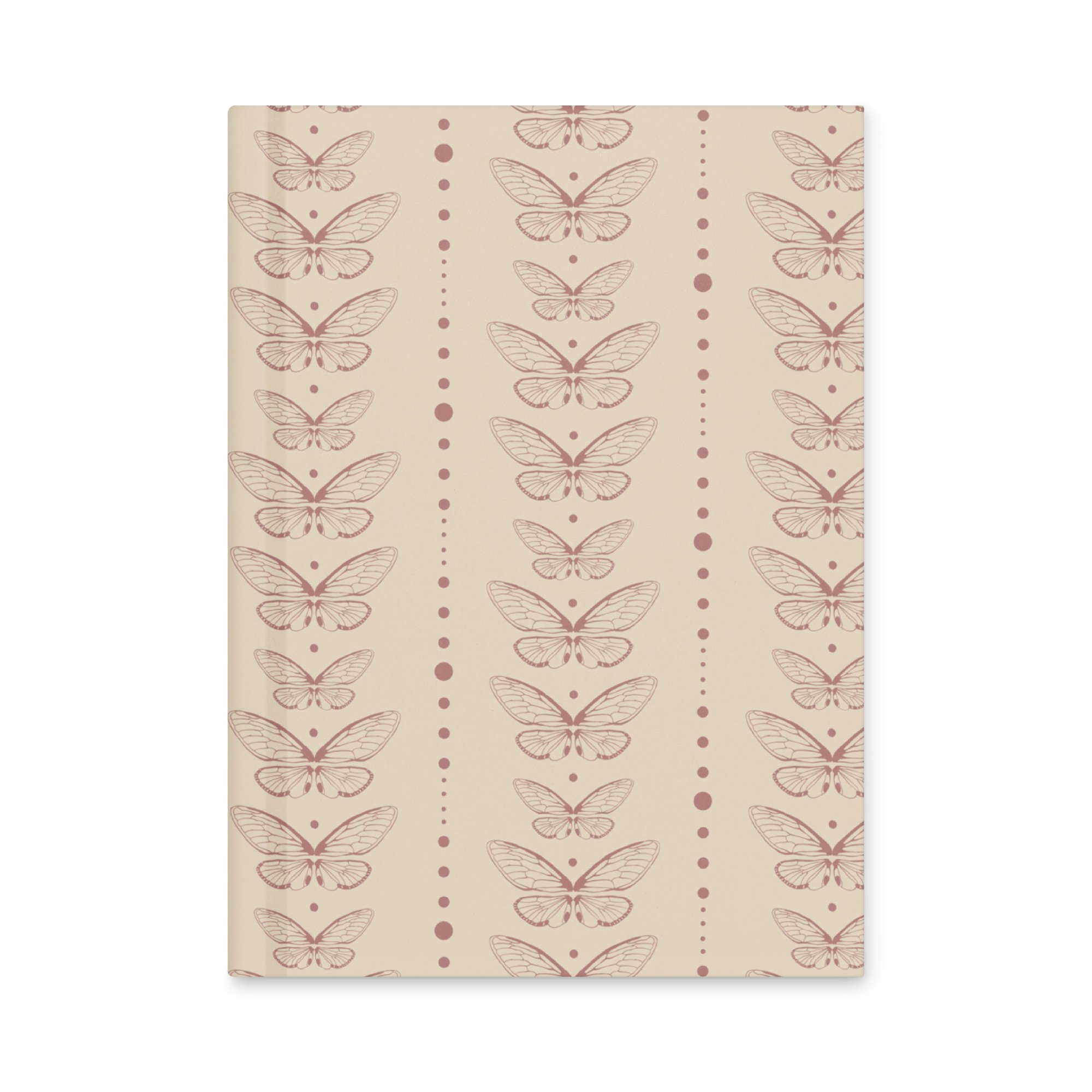Front view of Still Wing Archive journal with hand-drawn moth pattern in cream and muted mauve