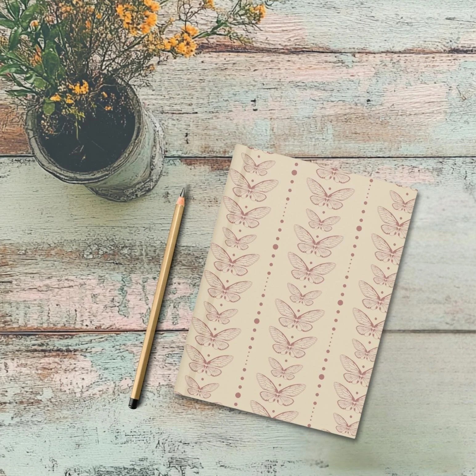 Still Wing Archive journal on wooden desk with wildflowers - botanical writing journal