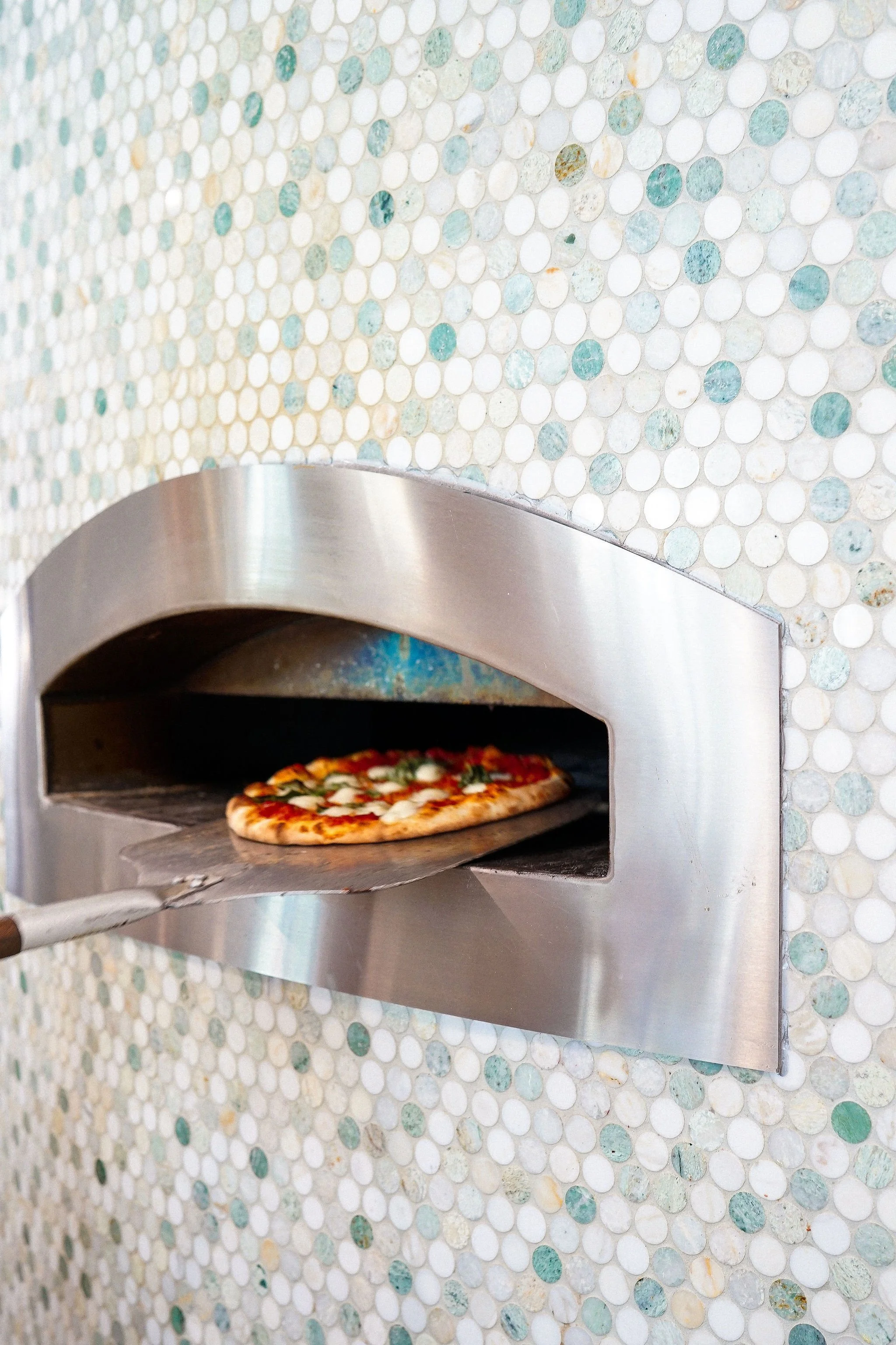 Pizza coming out of an oven in restaurant in Saint George, Utah
