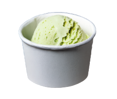 A cup of green ice cream in a white paper cup