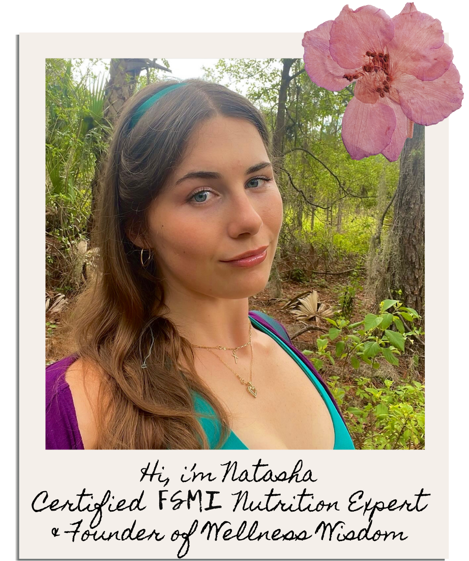 A woman named Natasha, a certified FSMI nutrition expert and founder of Wellness Wisdom, posing outdoors among trees and greenery.