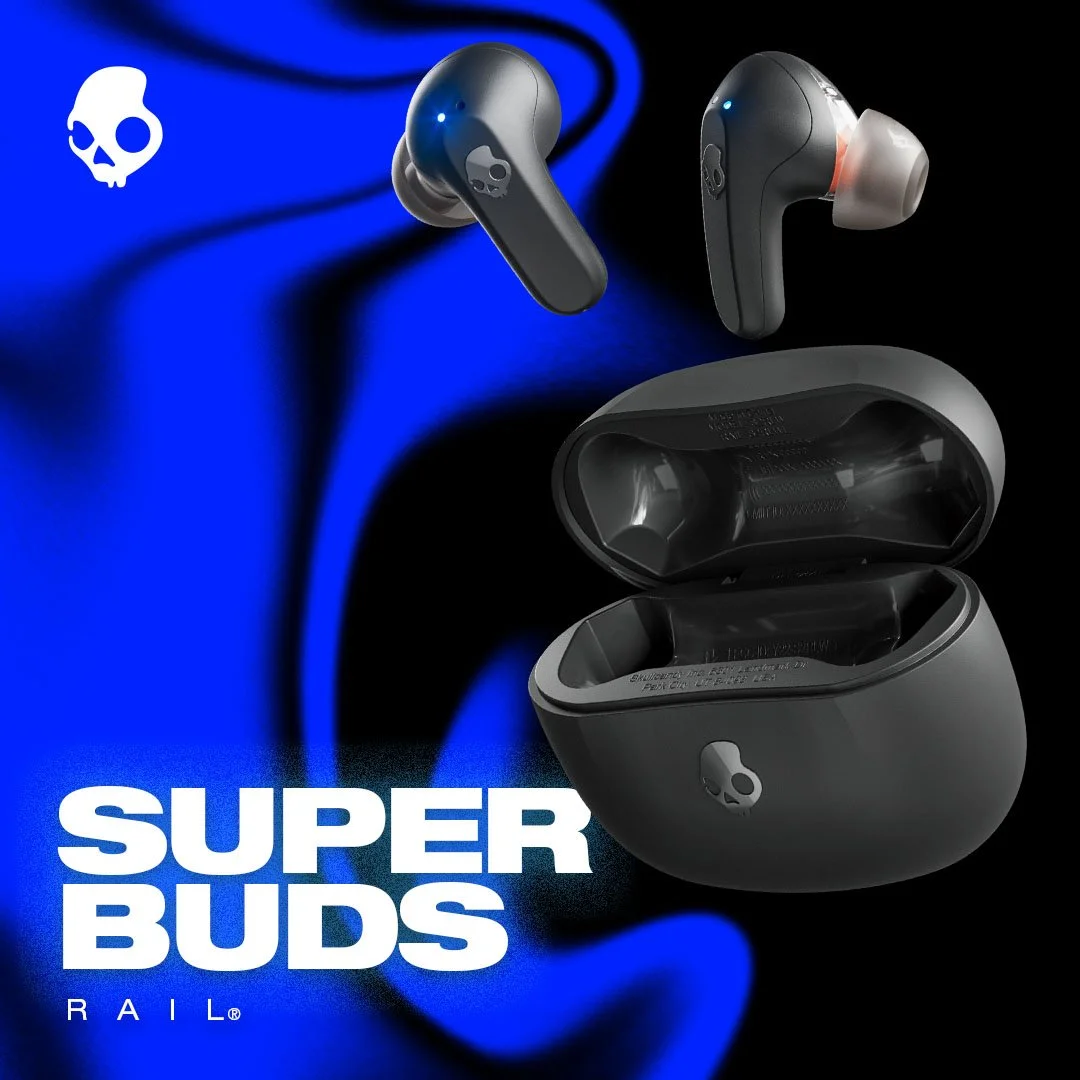 Wireless earbuds with a charging case on a black and blue background, featuring a skull logo. Text reads 'SUPER BUDS RAIL'.