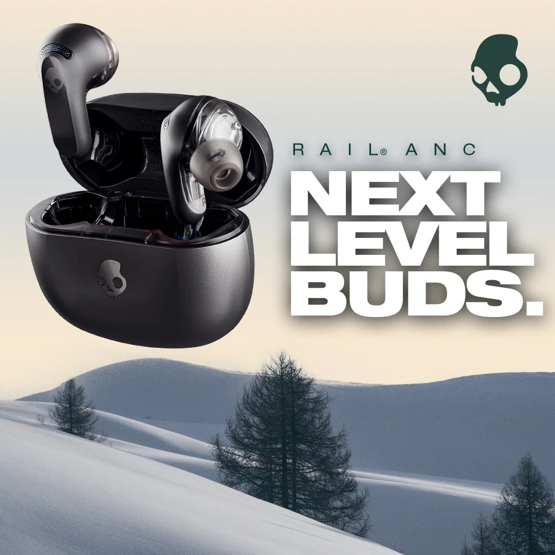 Wireless earbuds in charging case with snow-covered mountain landscape background and text 'Next Level Buds' and a logo with a skull.