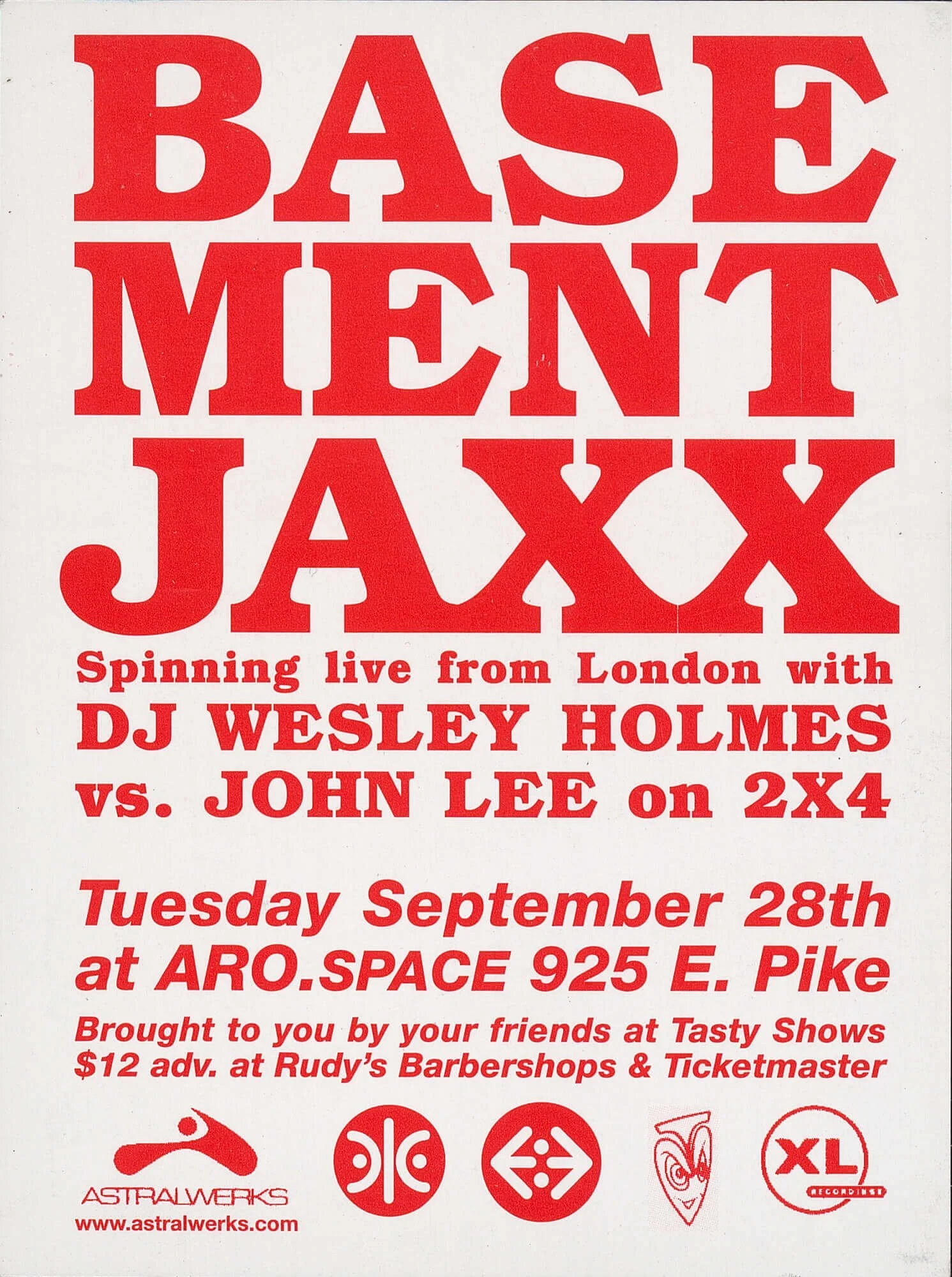 Concert flyer featuring large red text with event details for a live DJ performance by Base Ment JAXX, with DJ Wesley Holmes vs. John Lee, on Tuesday, September 28th at ARO.Space, 925 E. Pike, sponsored by Astralwerks and featuring various logos.
