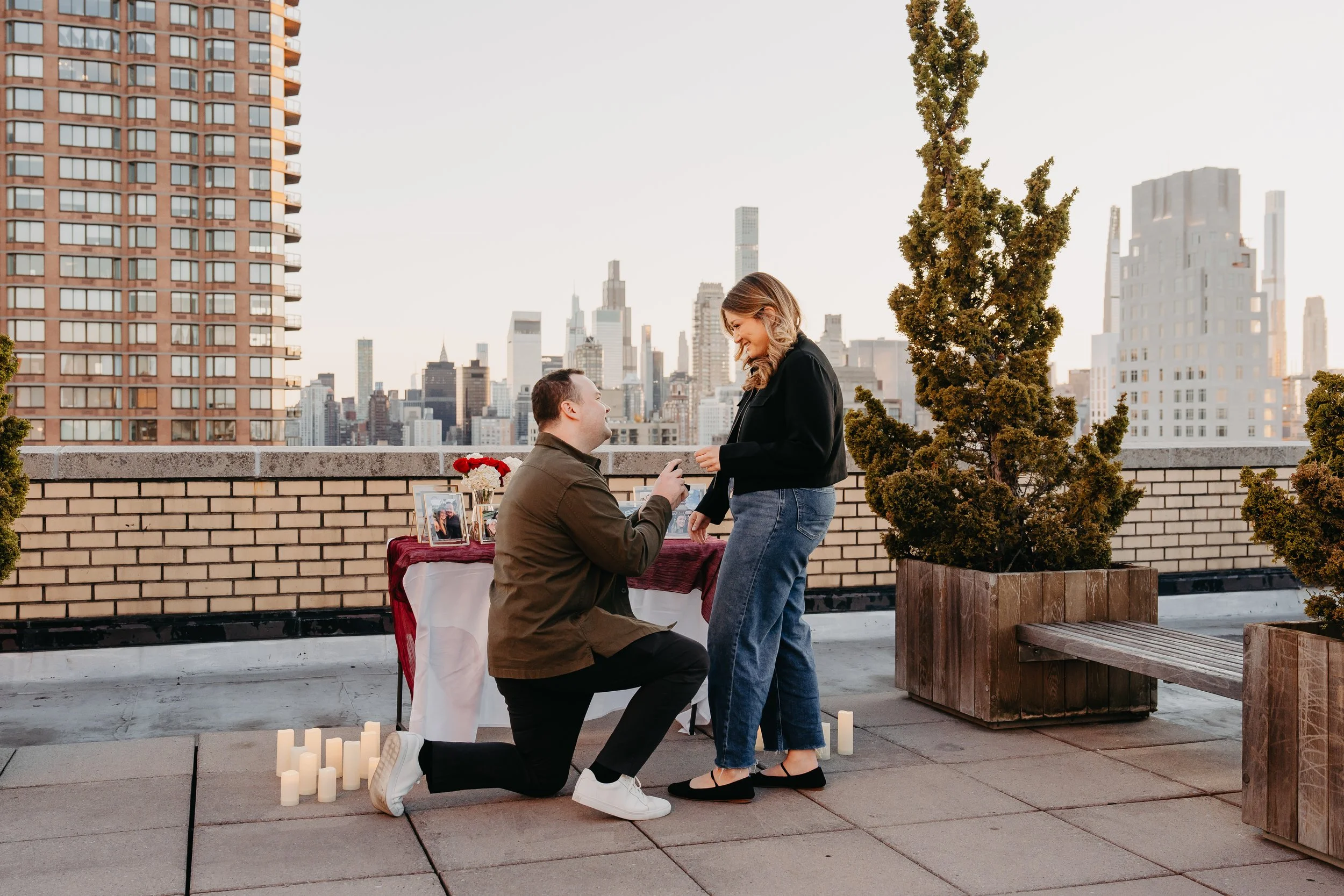Fitness equipment in a room with a black-and-white photo of a woman in denim shorts and tank top holding a surfboard on the wall.