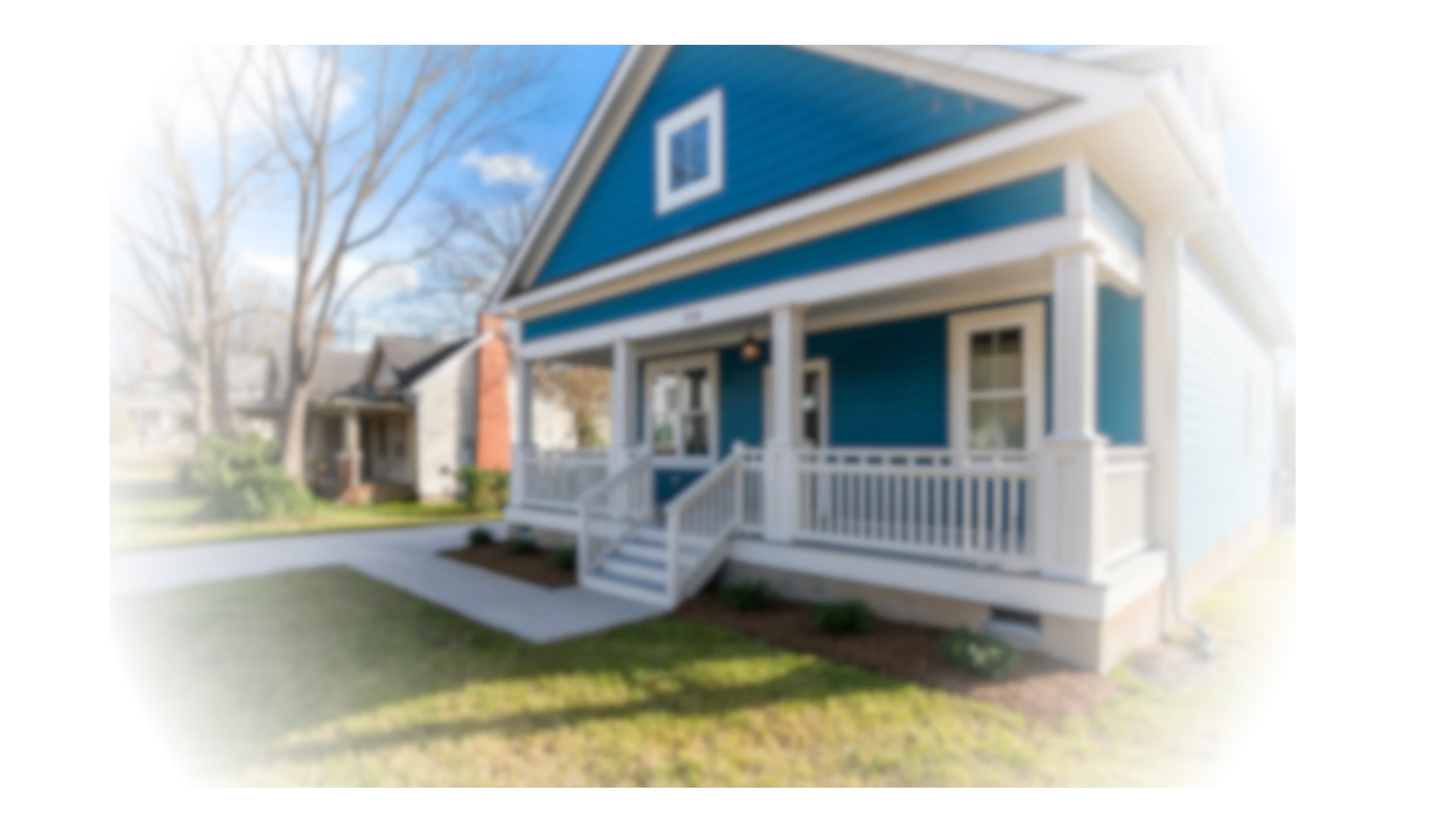 Residential home exterior with clean siding and front yard, showcasing professional pressure washing, lawn care, and property maintenance services by Phoenixx Land Services LLC.