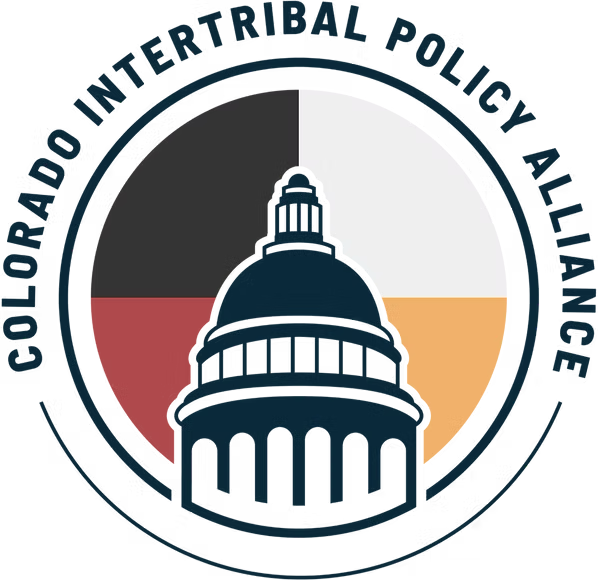 Logo of Colorado Intertribal Police Alliance featuring a stylized capitol building and a multicolored background with sections in white, black, red, and yellow, and the organization's name encircling the emblem.