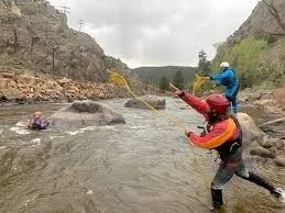 kayakers with throw bags
