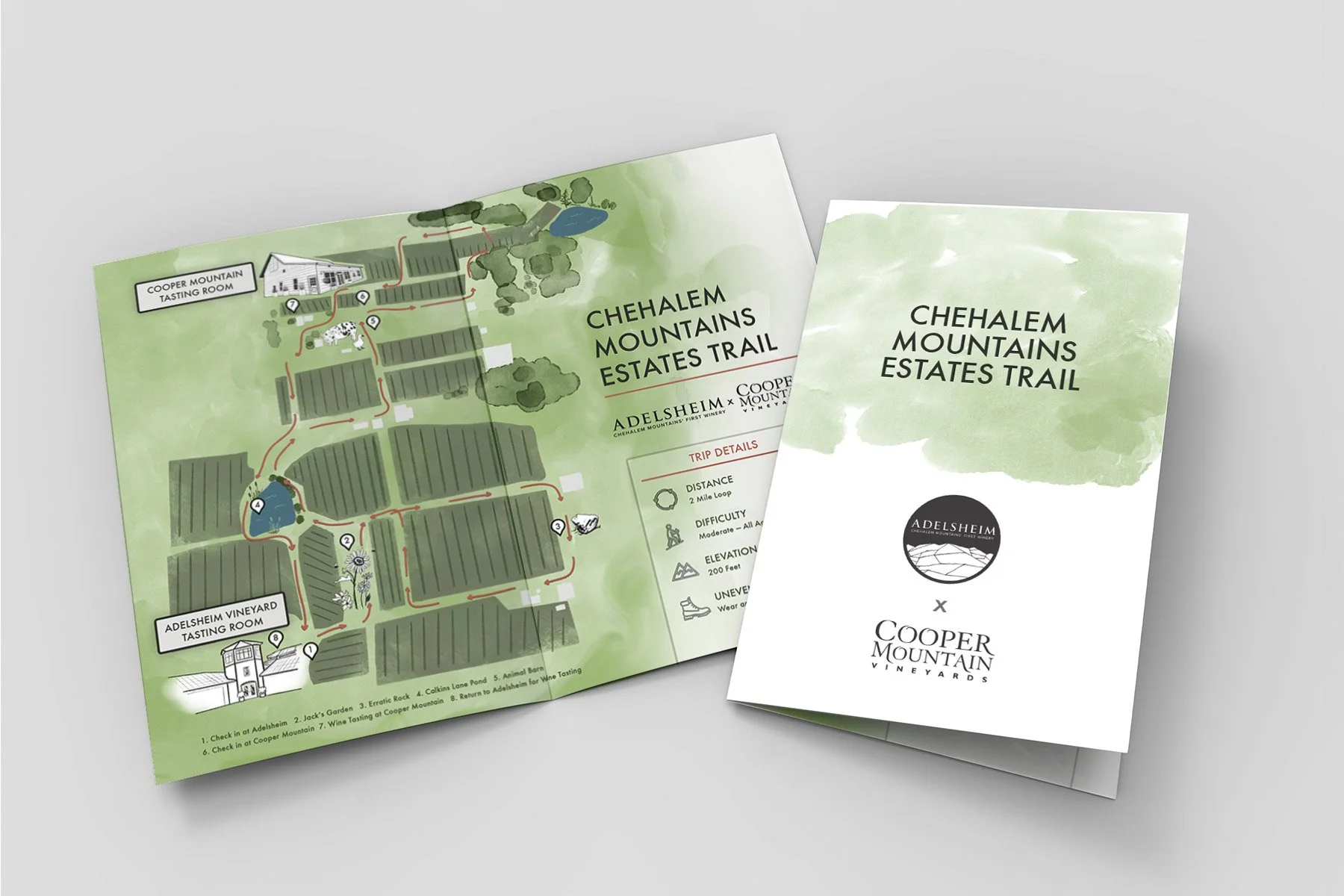 A folded, illustrated map highlighting the path between Adelsheim and Cooper Mountain tasting rooms, and notable sites along the way.