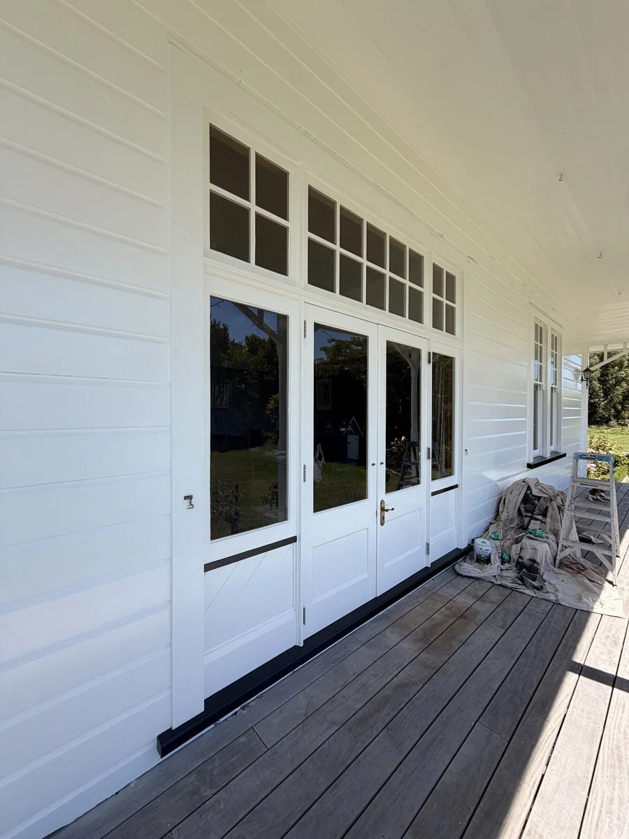 exterior-white-weatherboard-french-doors-veranda-freshly-painted.jpg
