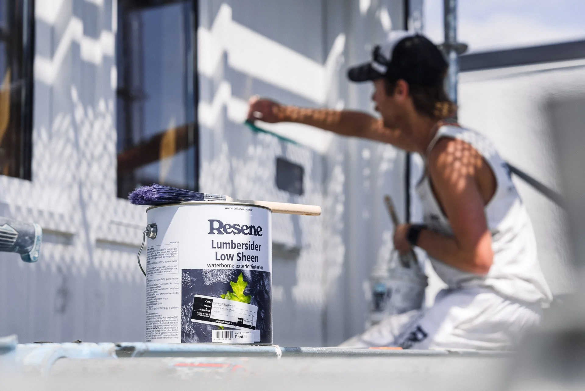 painter-applying-resene-lumbersider-exterior-weatherboard.jpg