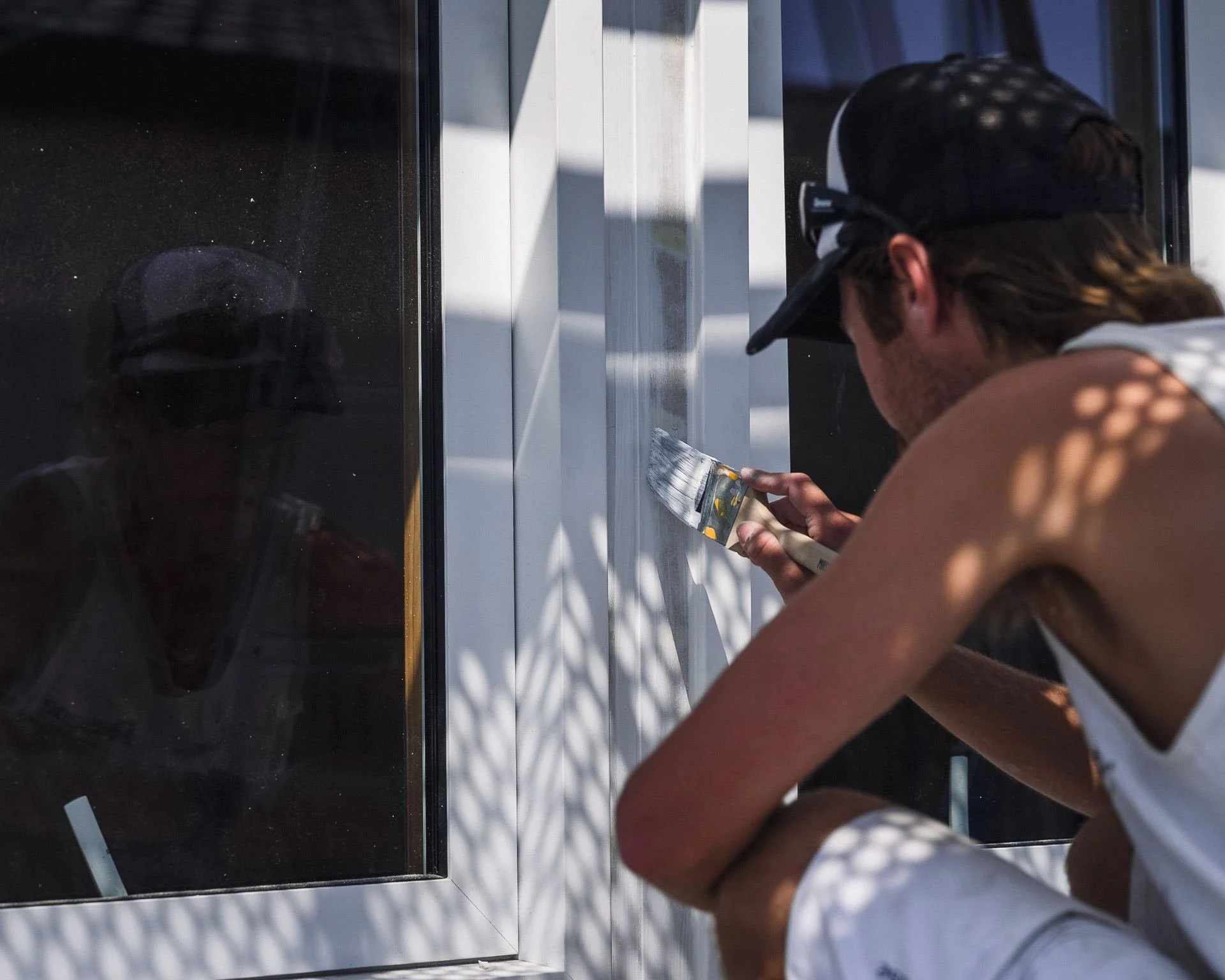 painter-cutting-in-window-trim-close-up.jpg