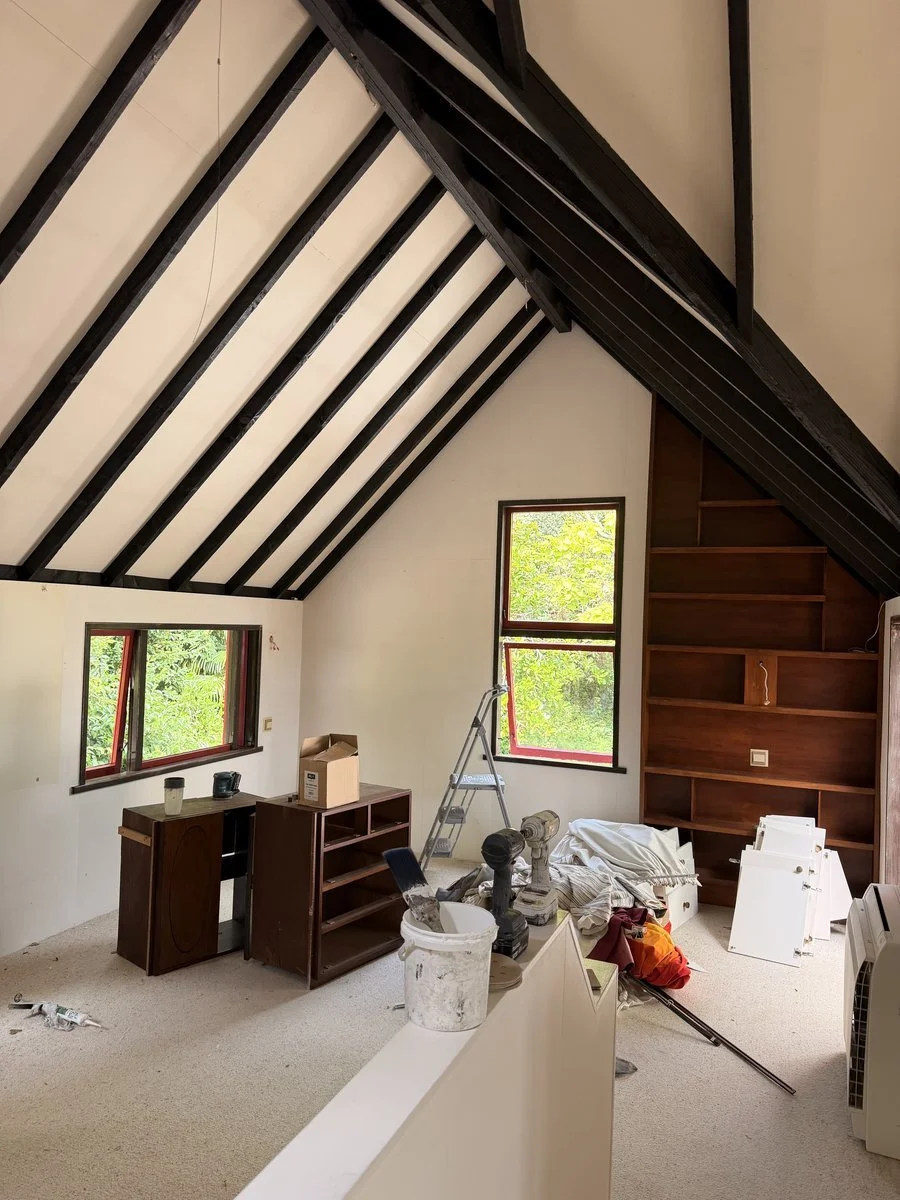 interior-attic-room-mid-paint-exposed-rafters-renovation.jpg
