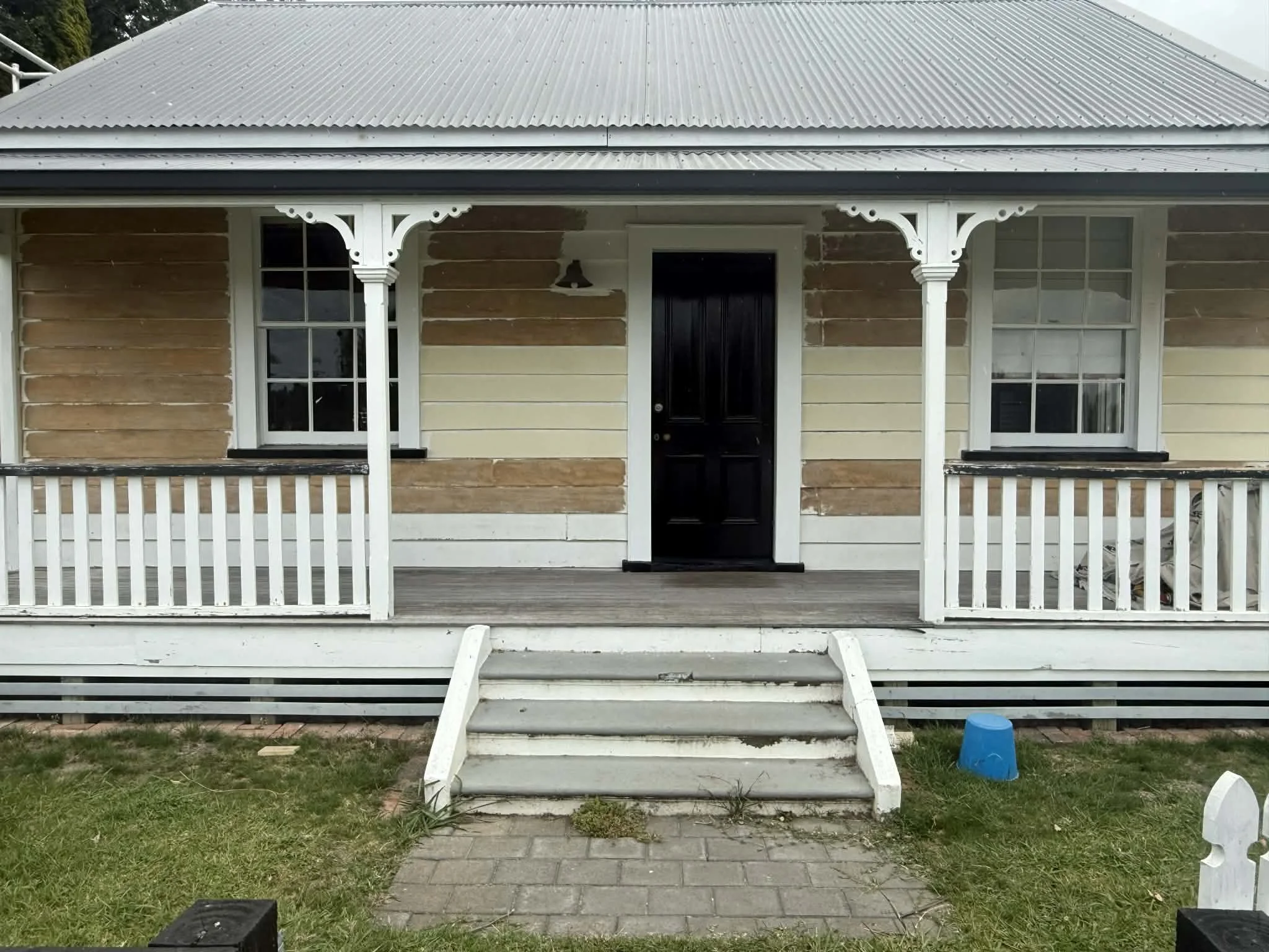 villa-exterior-prep-mid-strip-weatherboard-front-porch.jpg