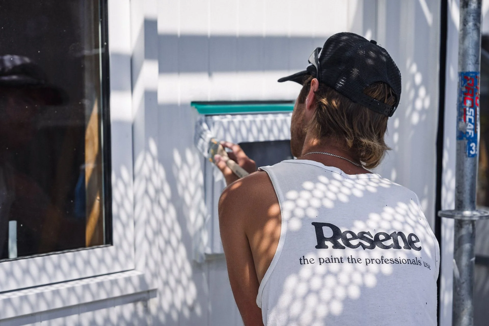 painter-rolling-exterior-weatherboard-resene-singlet.jpg