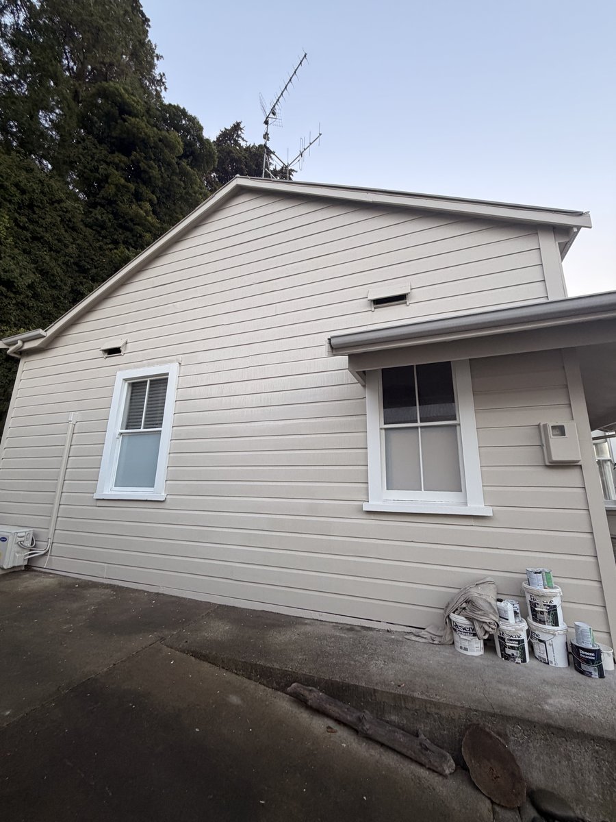 coote-road-exterior-side-wall-painted-weatherboard-paint-cans.jpg