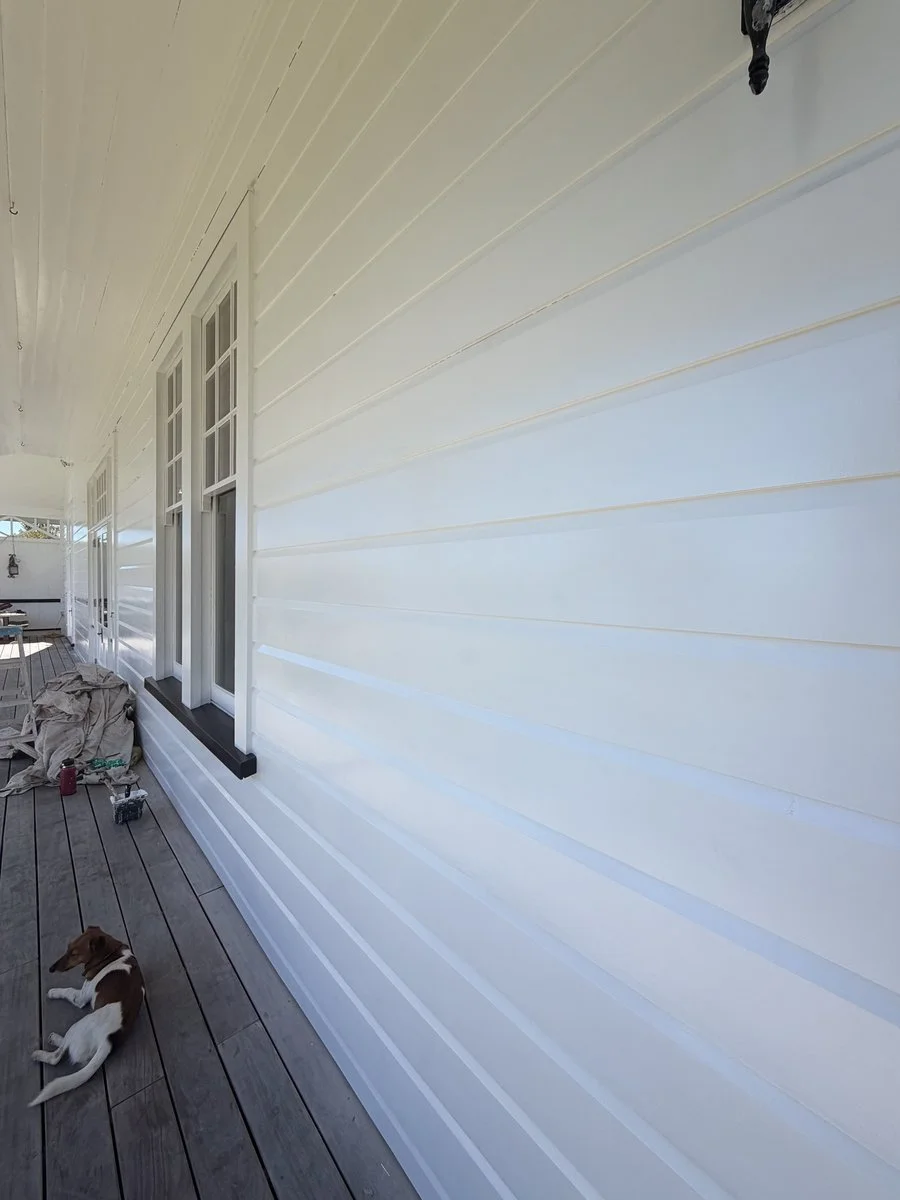 villa-exterior-weatherboard-freshly-painted-white-verandah.jpg