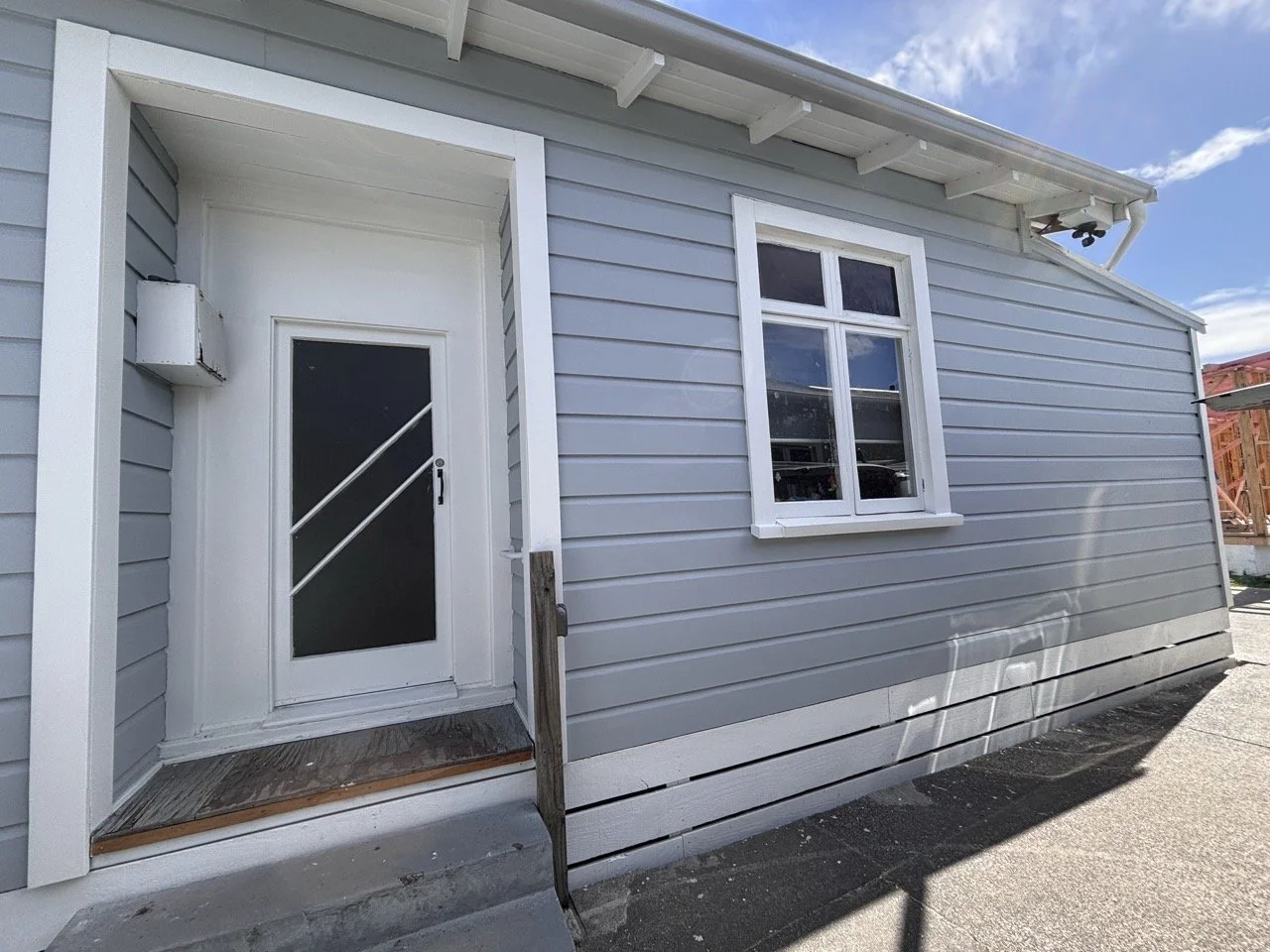 kennedy-road-exterior-front-entry-grey-weatherboard.jpg