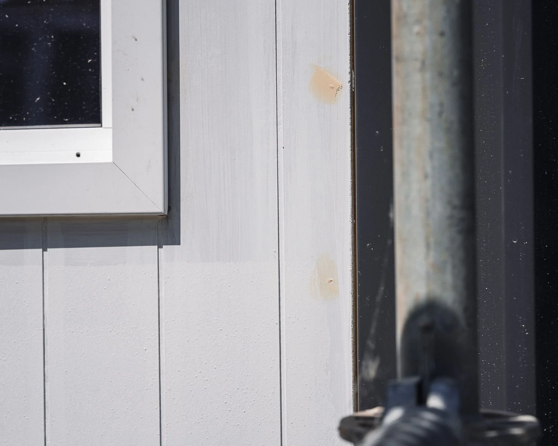 exterior-cladding-filler-dabs-beside-window-trim-prep.jpg