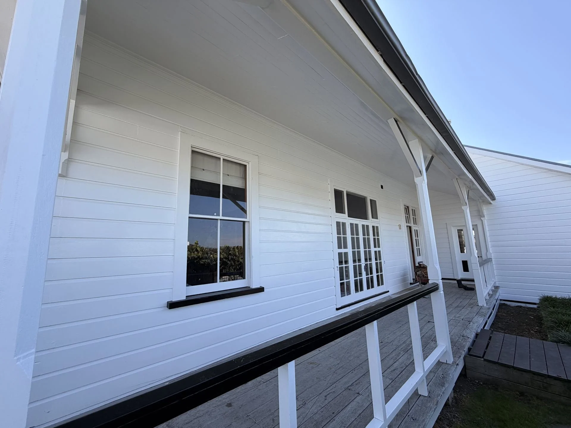 exterior-white-weatherboard-verandah-freshly-painted.jpg