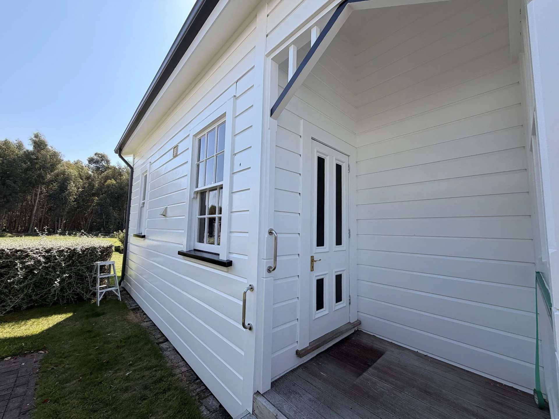 exterior-repaint-white-weatherboard-cottage-front-entry.jpg