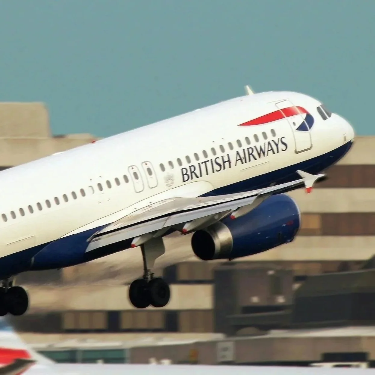 A British Airways airplane taking off from an airport runway.