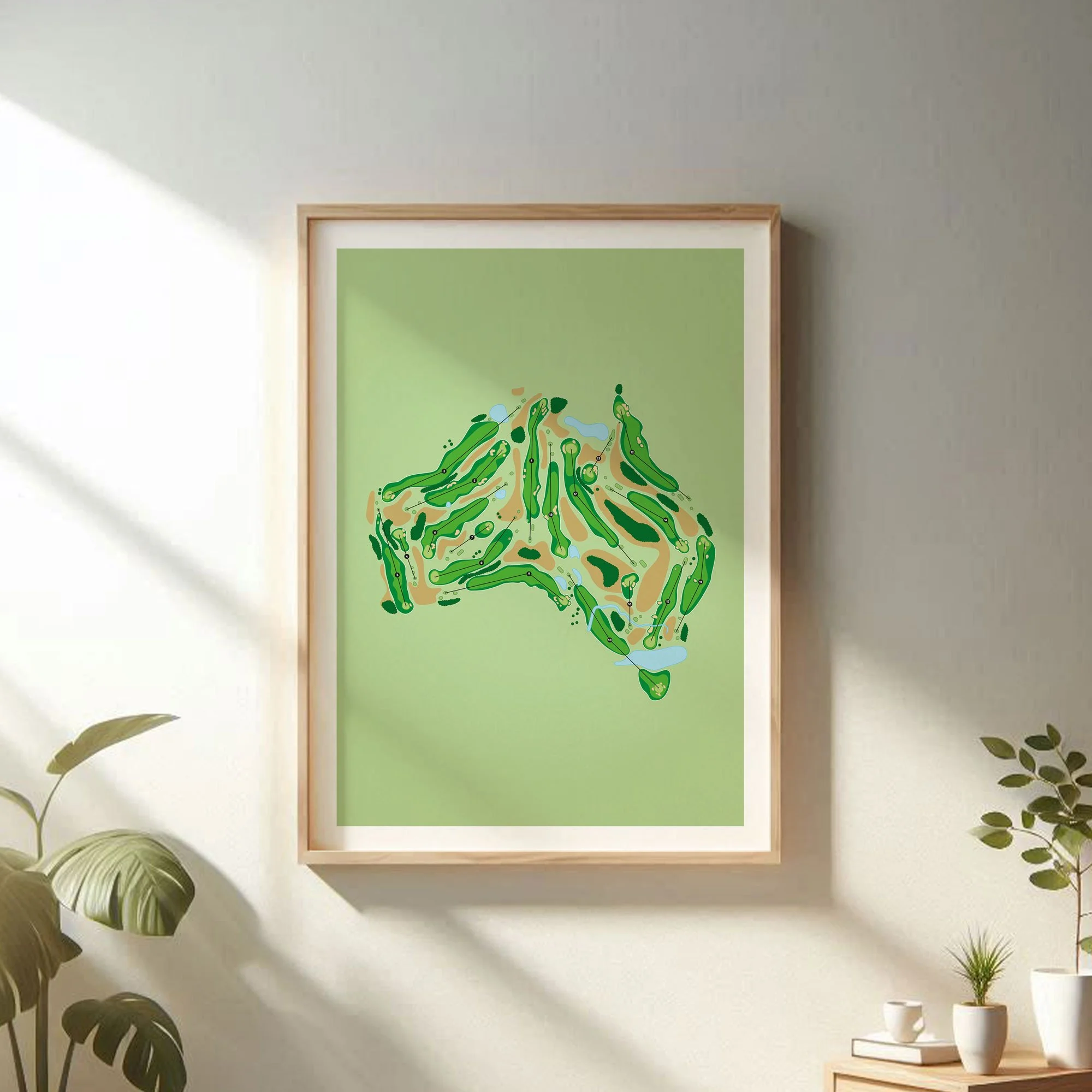 Framed golf course maps of New Zealand and Australia