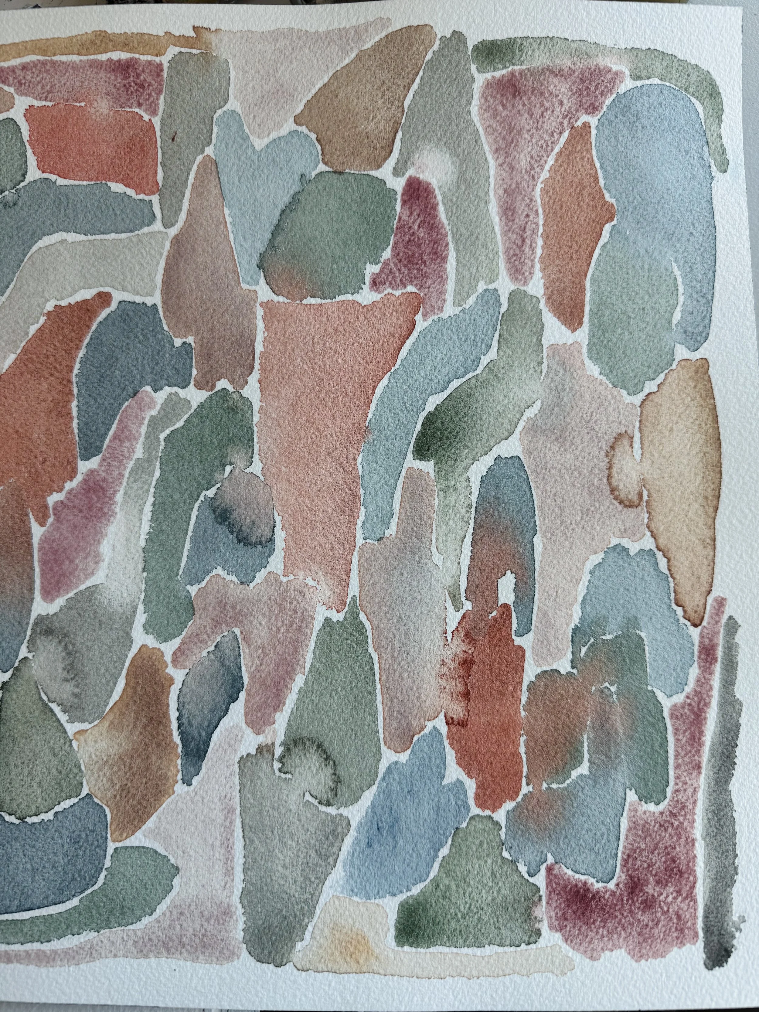 Abstract watercolor painting with multicolored patches in shades of green, blue, red, pink, and brown.