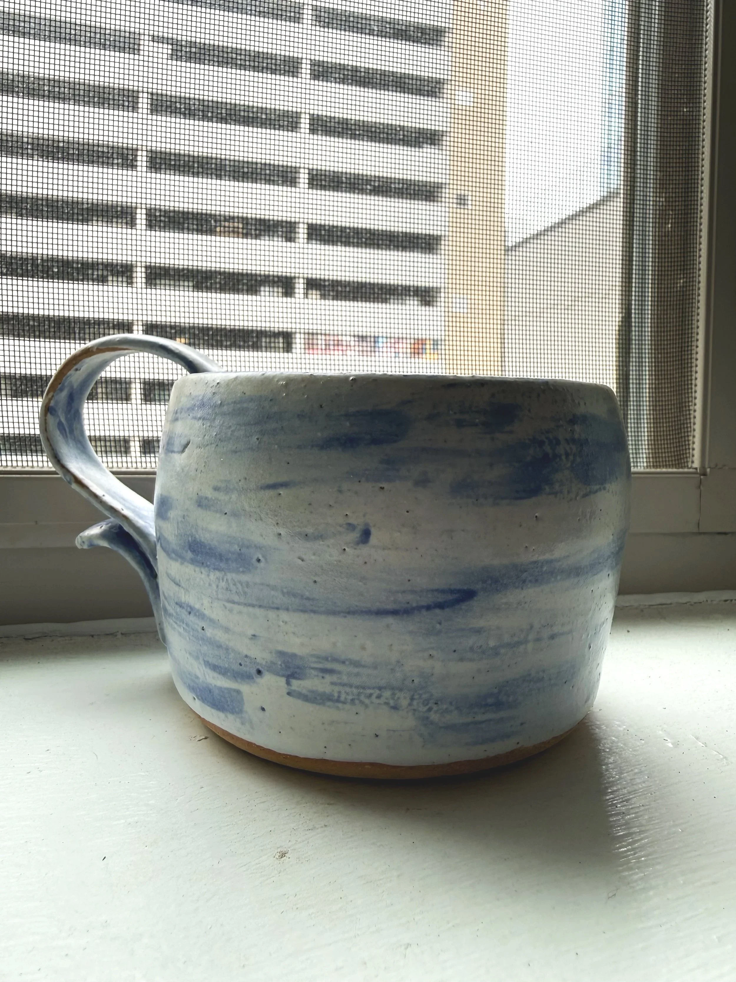 12 ounce mug glazed in a blue and white pattern