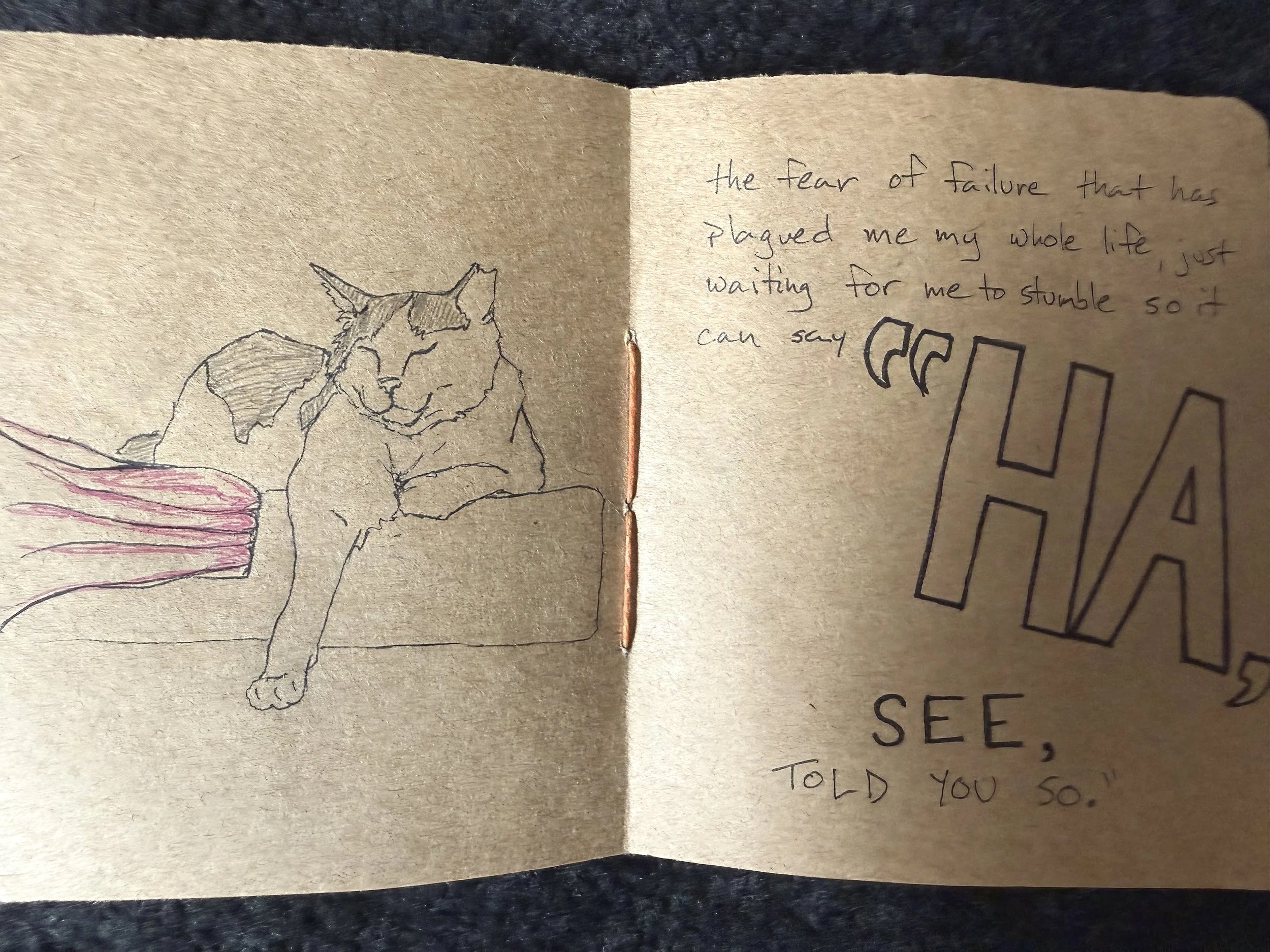 Two pages from WORTHless, an art zine, with an illustration of a cat with eyes closed on one side and text on the other.