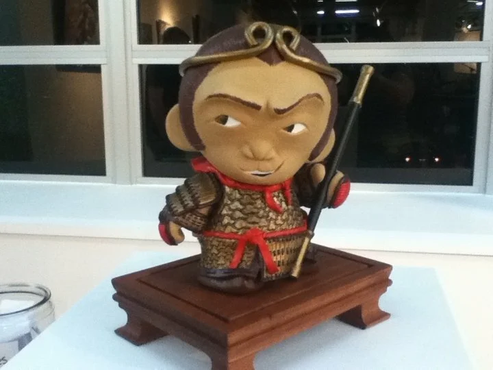 VInyl toy customization depicting the Monkey King, Sun Wu-Kong, with golden band around his head and staff