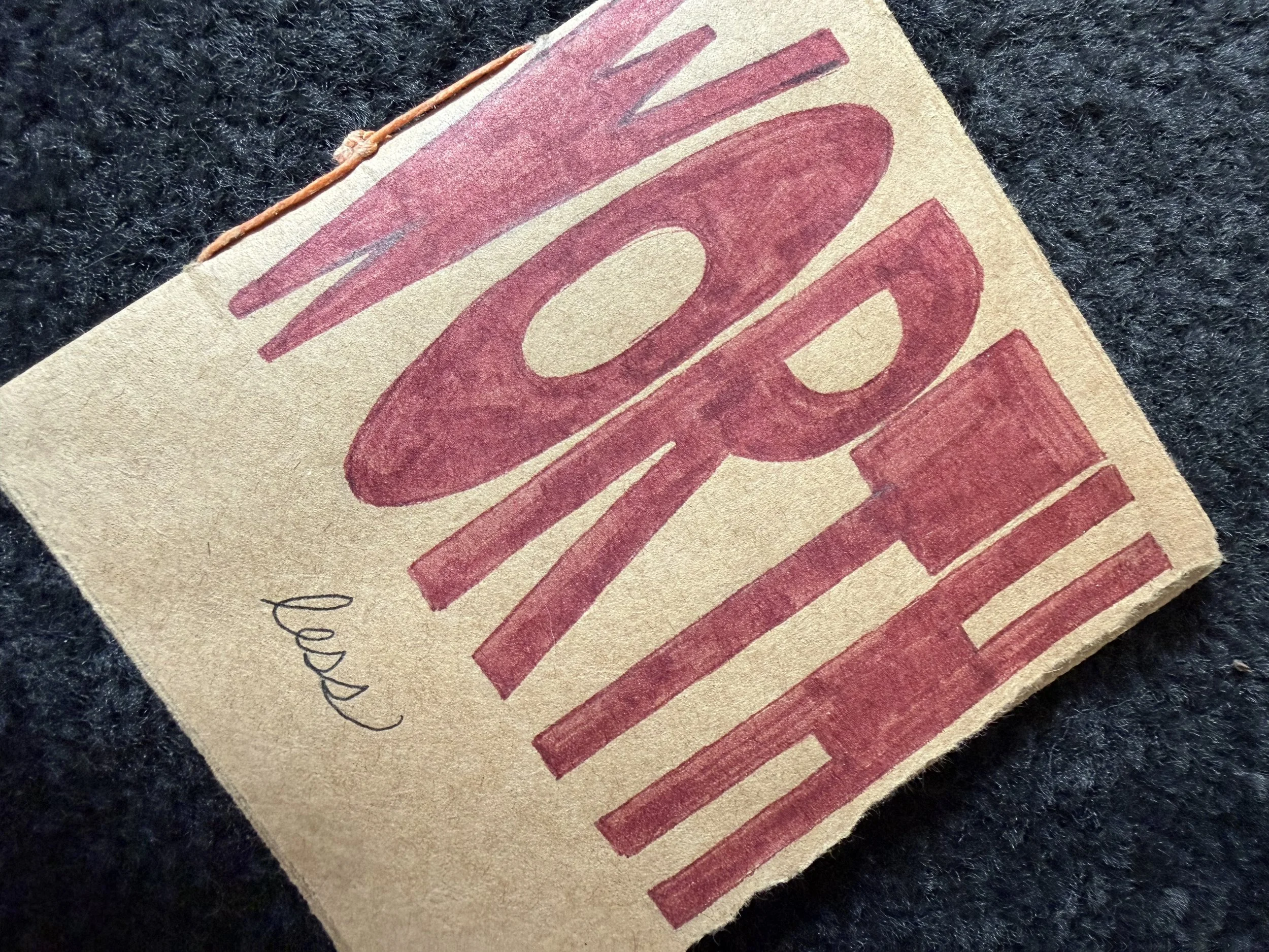 Cover to the WORTHless art zine made with recycled craft paper