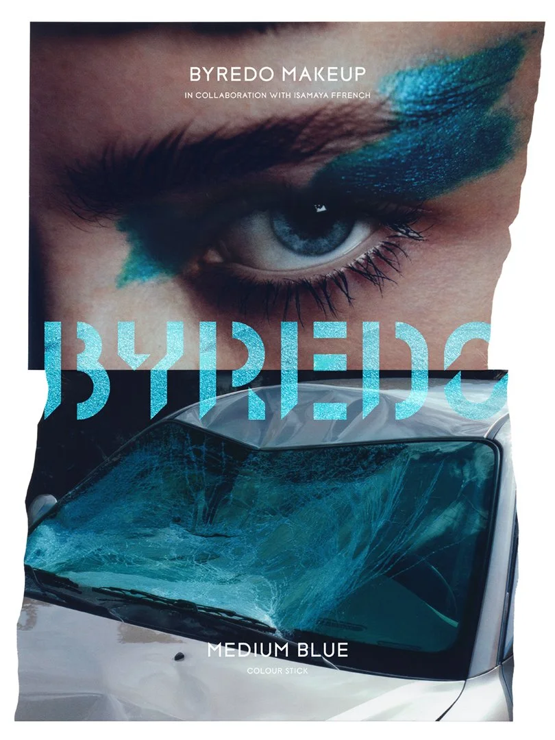 Packaging for BYREDO MAKEUP in collaboration with Isamaya Ffrench featuring a close-up of a person's eye with eye makeup and a shattered windshield reflected on a car hood, with the text 'MEDIUM BLUE' and 'COLOUR STICK' at the bottom.