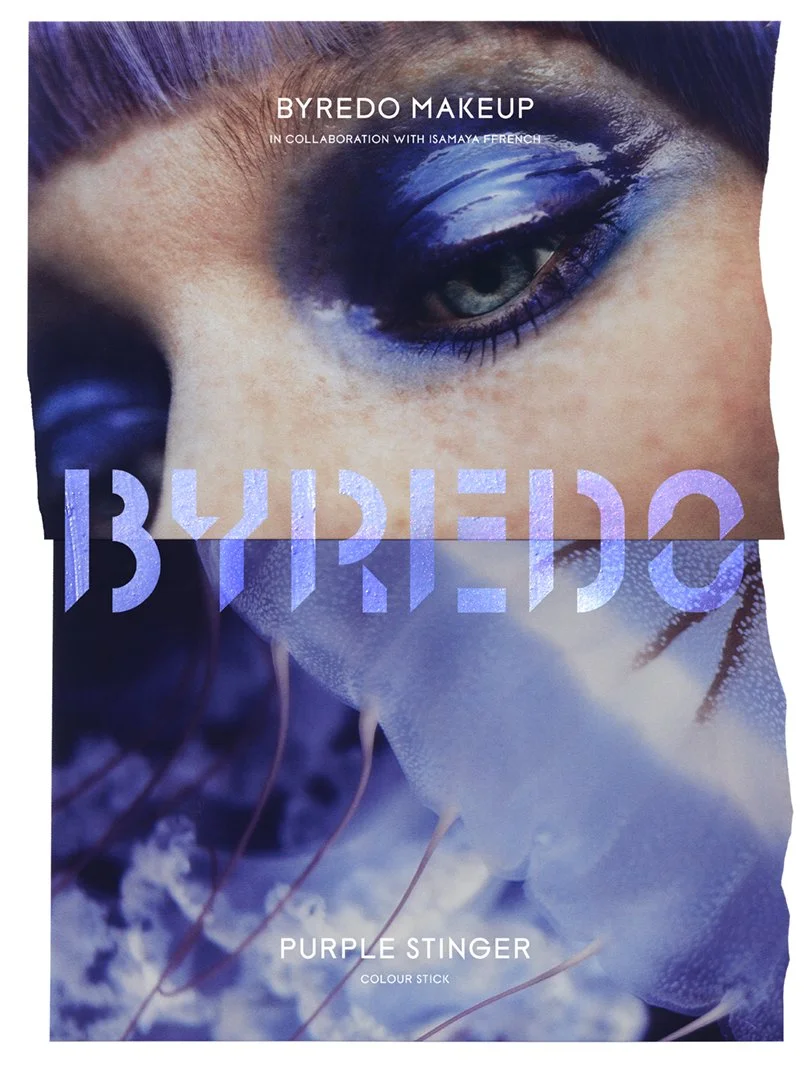 Packaging for Byredo Makeup, collaboration with Isamaya Ffrench, featuring a close-up of a model with purple eye makeup, and the product 'Purple Stinger Colour Stick' in bold purple text over a blue-toned abstract background.