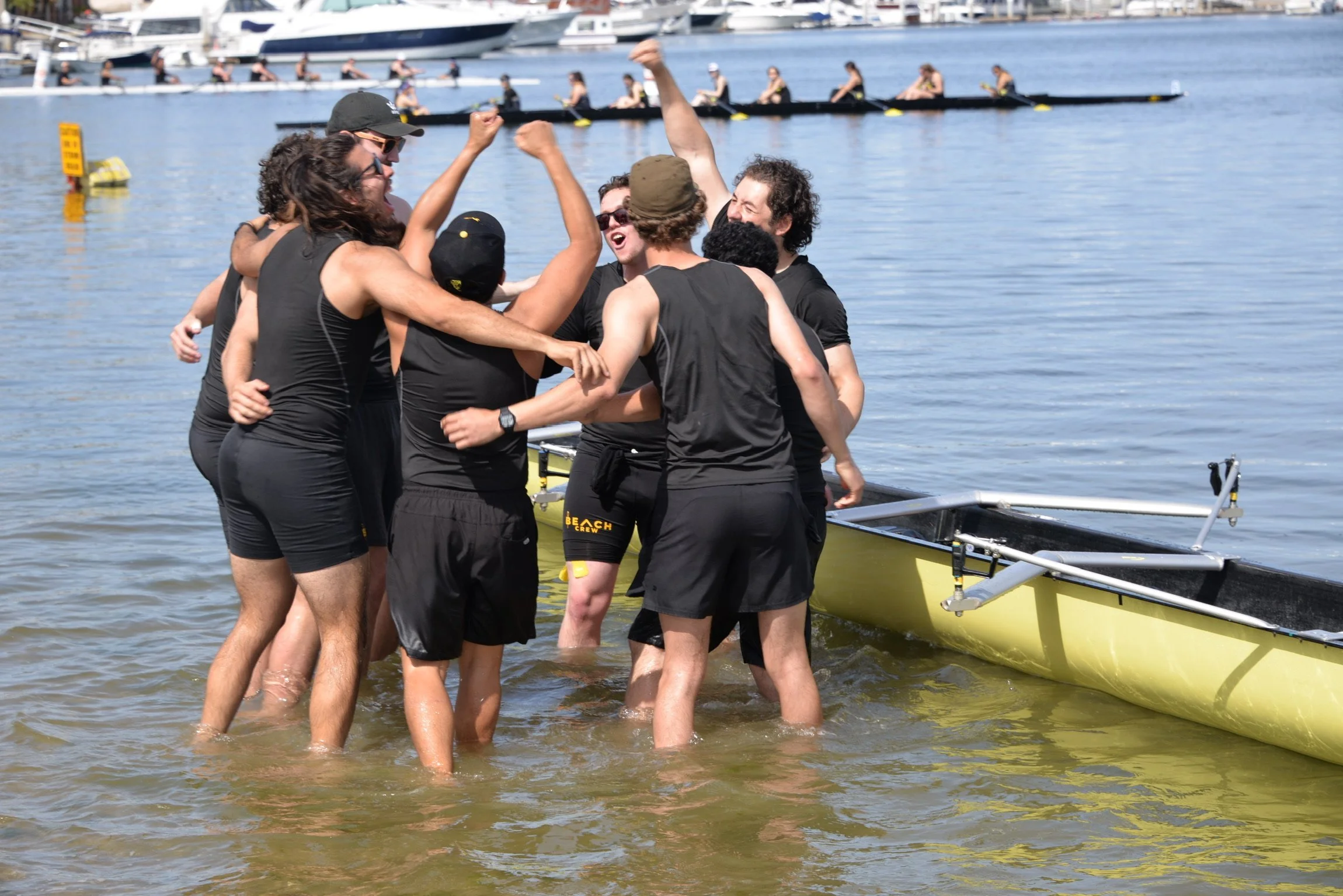 The Men’s Crew mixed boat celebrating with a Go Beach after their streak of undefeated races.
