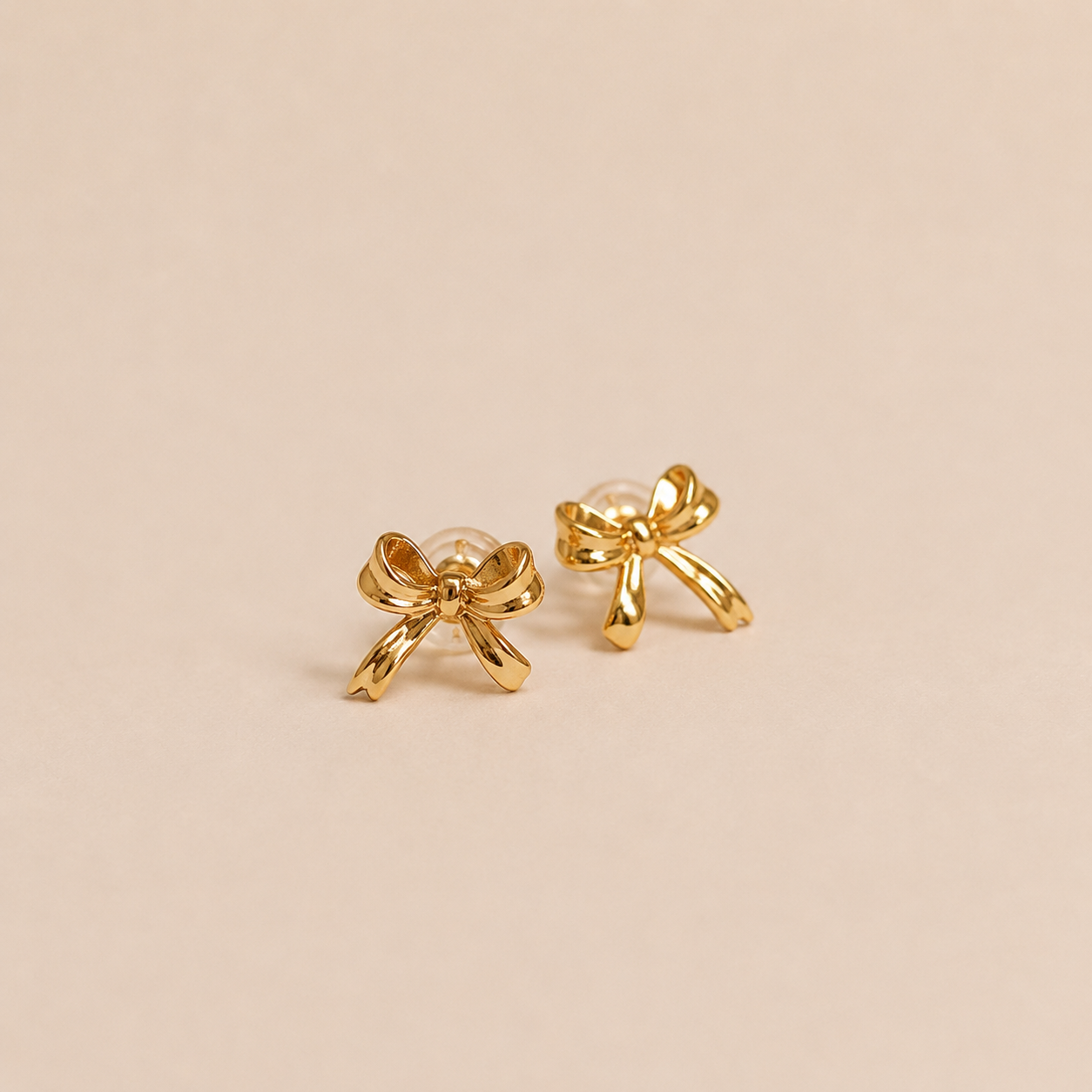 bow earring gold.png