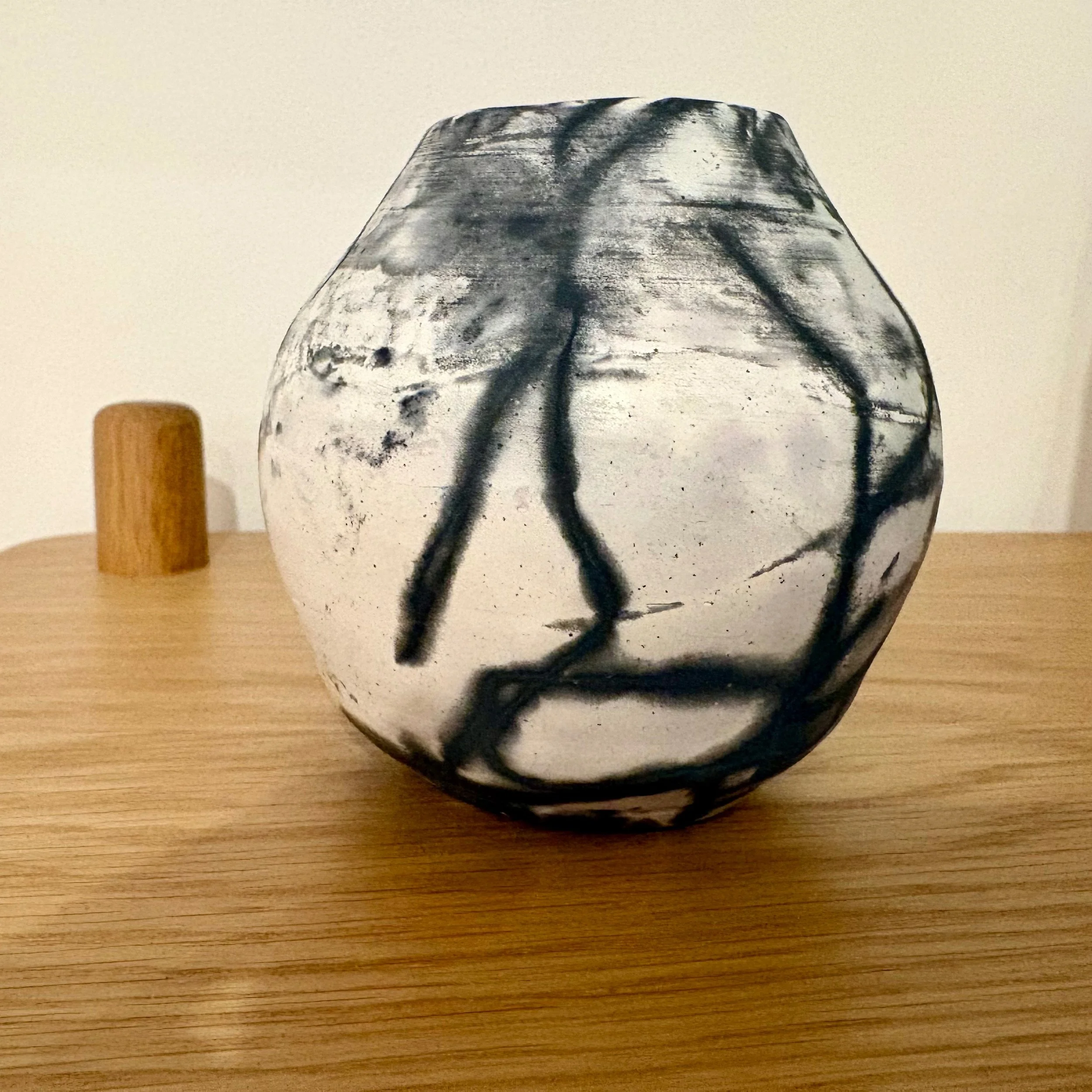 Saggar Firing Experiment - Post Firing. No it didn't shrink THAT much, it's a different pot. 😂