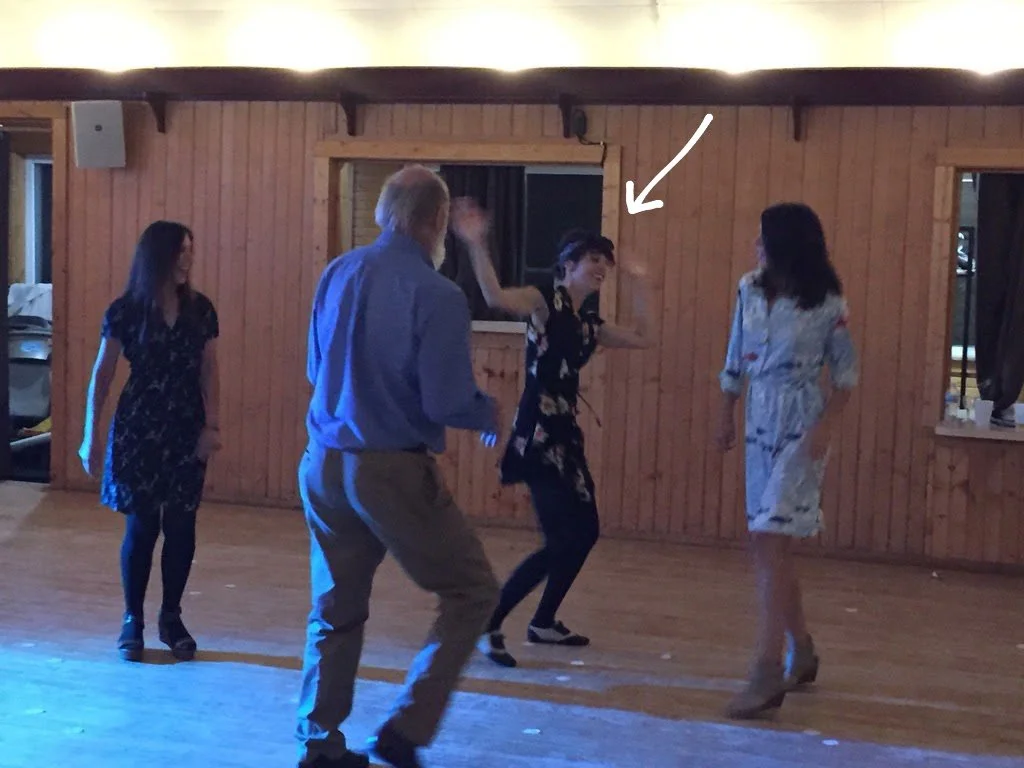 Regan Smith dancing poorly while people look on