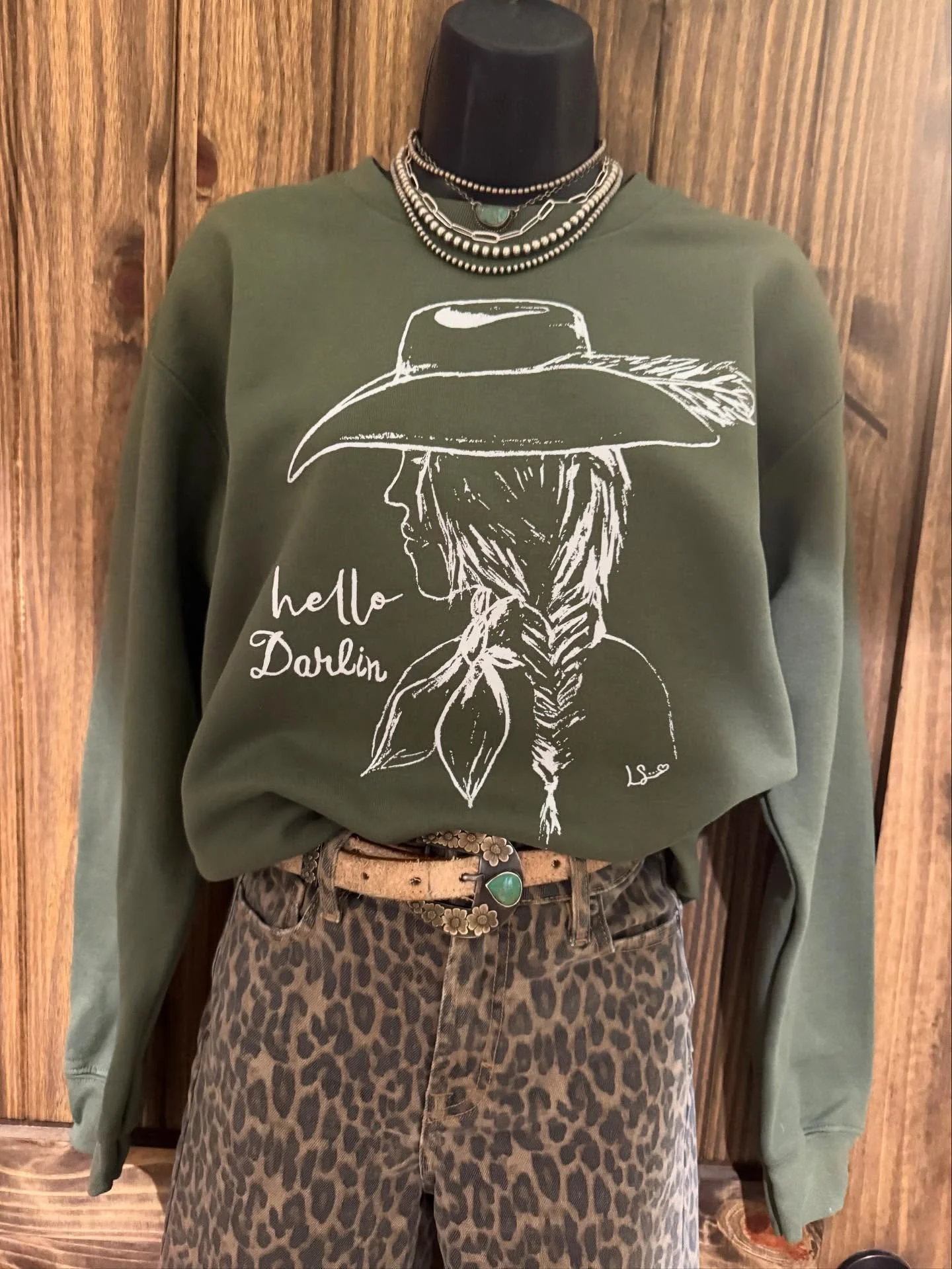 This adorable sweatshirt is the perfect piece to cozy up in this fall! 🍂 The soft olive-green color is right on trend and pairs beautifully with jeans, leggings, or your favorite printed pants. 

All the shirt prices and details are available on the