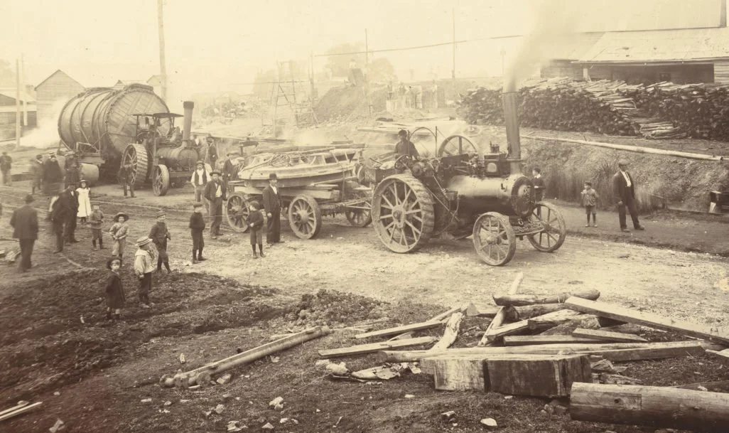 Historical image showing Pearns brothers and old steam engines