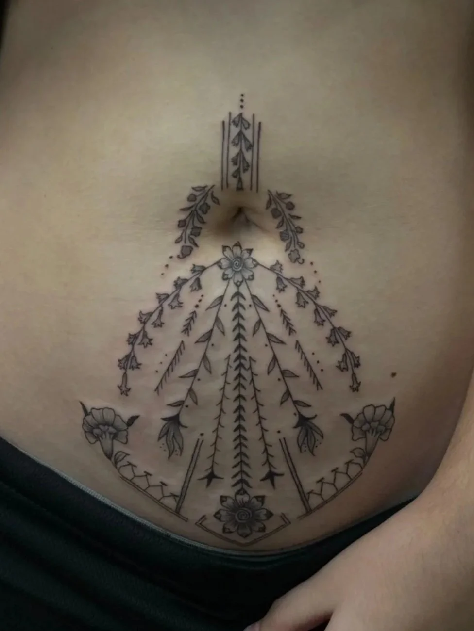 Fineline henna inspired fertility tattoo