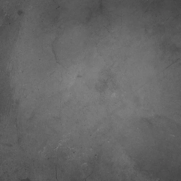 A gray, textured concrete surface with visible cracks.