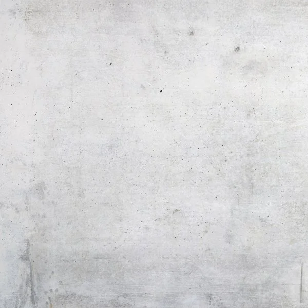 Plain concrete wall with some discoloration and small marks