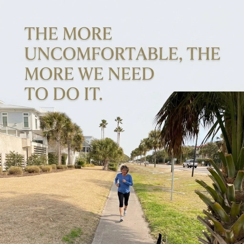 A woman jogging on a sidewalk in a coastal area with palm trees, houses, and cars in the background. Overlaid text reads, "The more uncomfortable, the more we need to do it."
