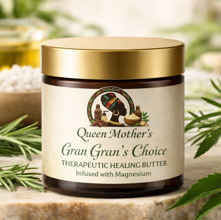 A jar of Queen Mother's Gran Gran's Choice Therapeutic Healing Butter infused with magnesium, placed on a surface with greenery around.
