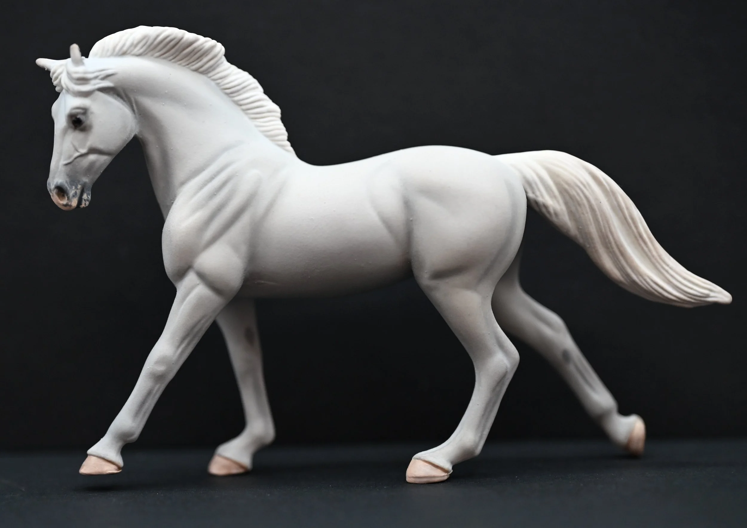 Custom Breyer Galloping Warmblood Stablemate repainted to a fully grayed portrait of Lord of the Rings "Shadowfax". Painted by Liz Raby of Serene Studios.