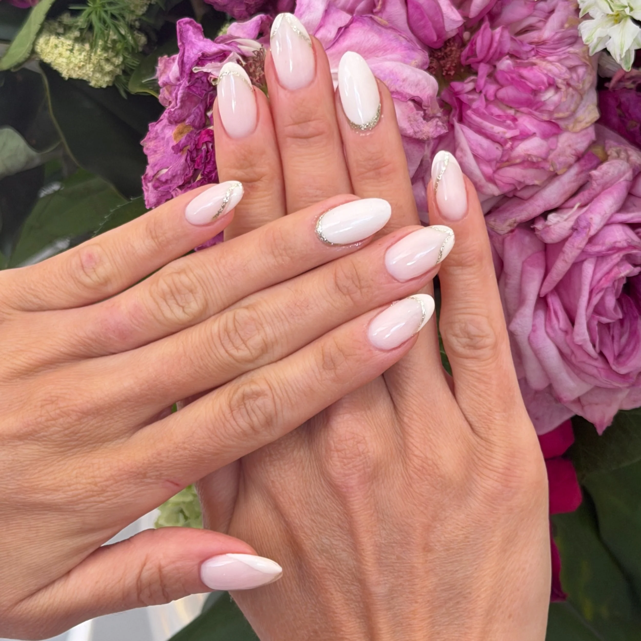 Fancy take on your French mani 

What to ask for: 
Service: Gel X - nail extensions 
Colour: Dreamer with white art French and silver glitter trim 
Length: long