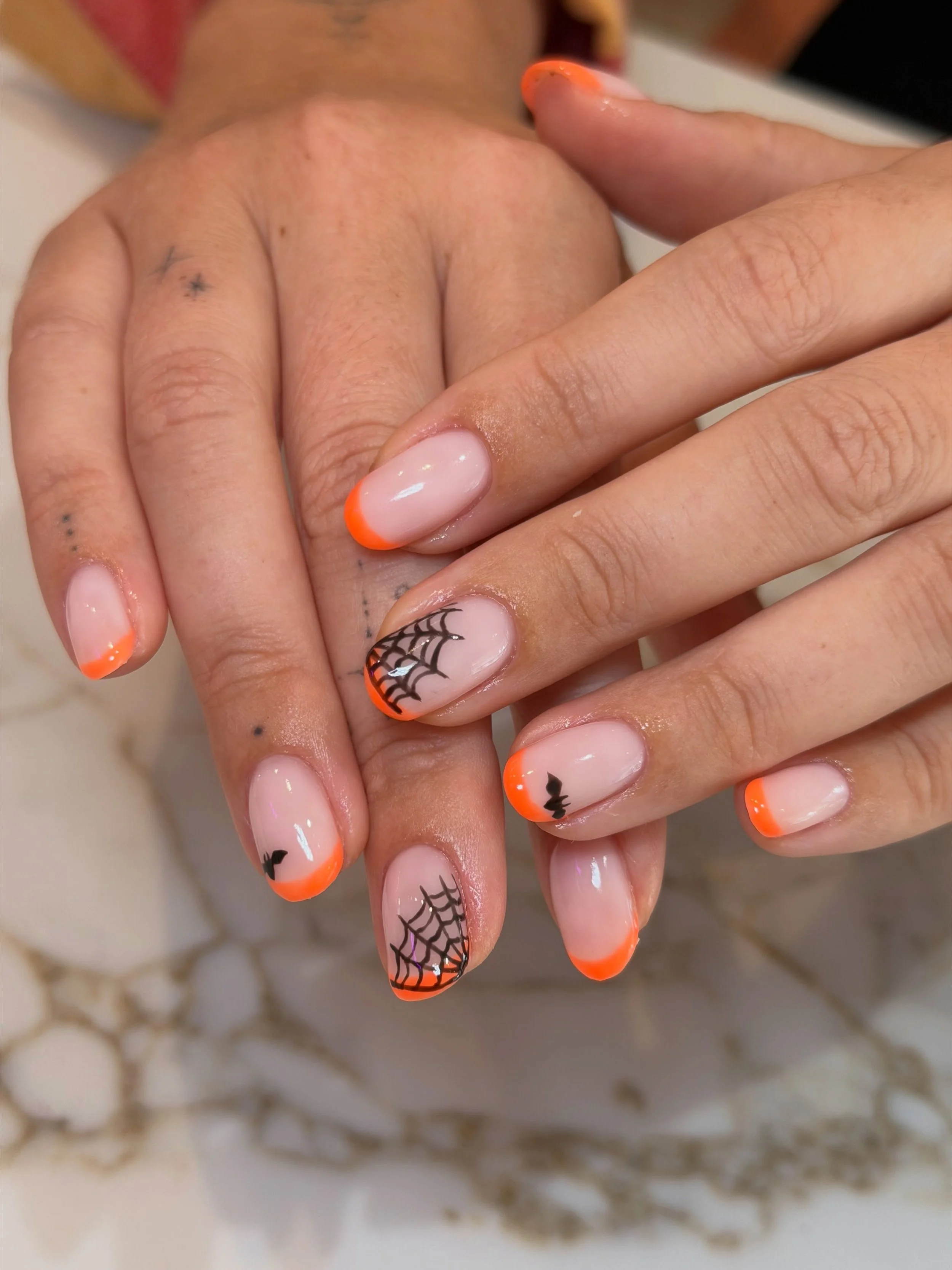 Spooky season, but make it French🎃

What to ask for?
Service - BIAB with nail art, bring your nail inspo. we love creating custom designs for you.
Length - short to medium