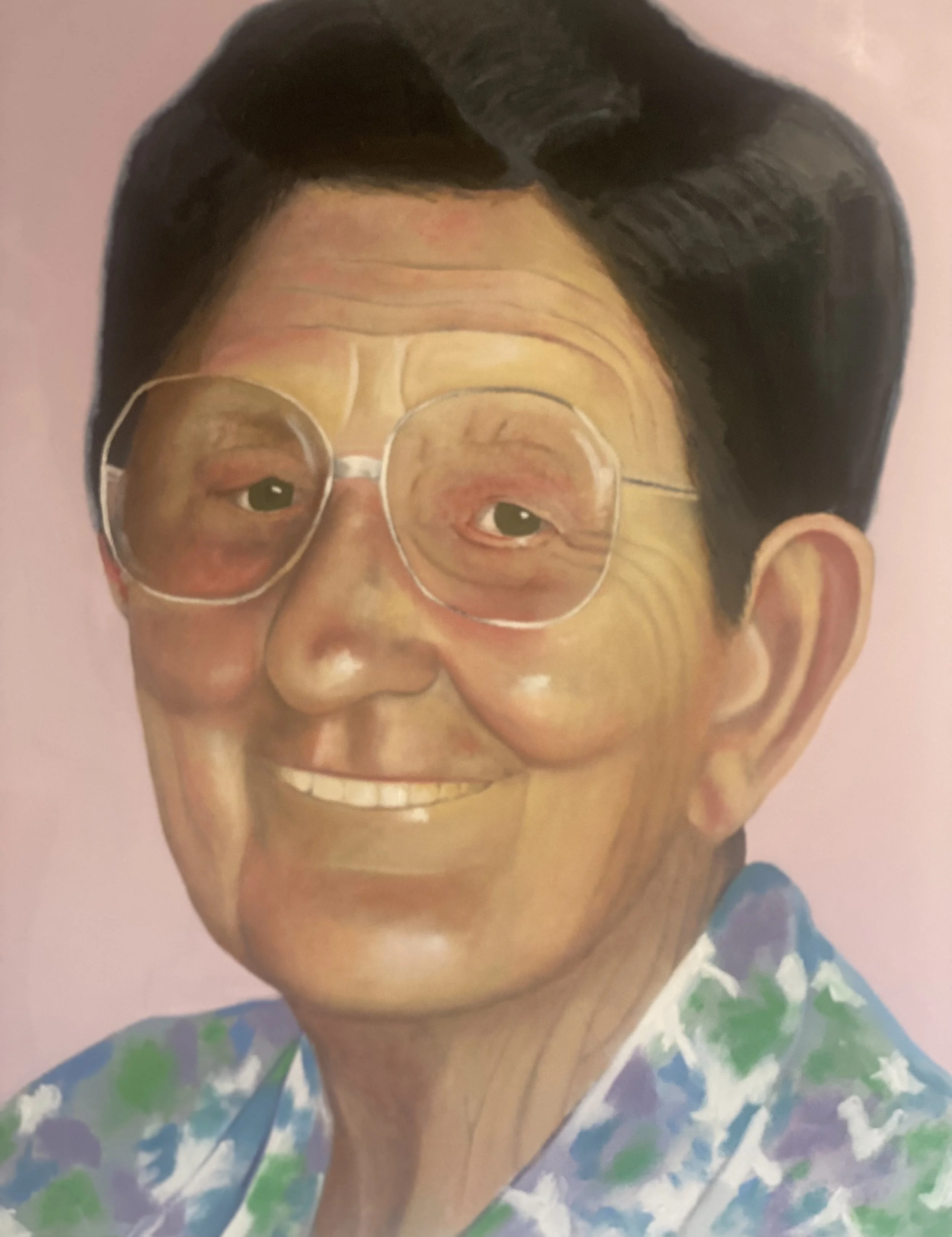 A bespoke commission painting of an elderly woman with black hair, glasses, and a cheerful smile, wearing a colorful patterned shirt.