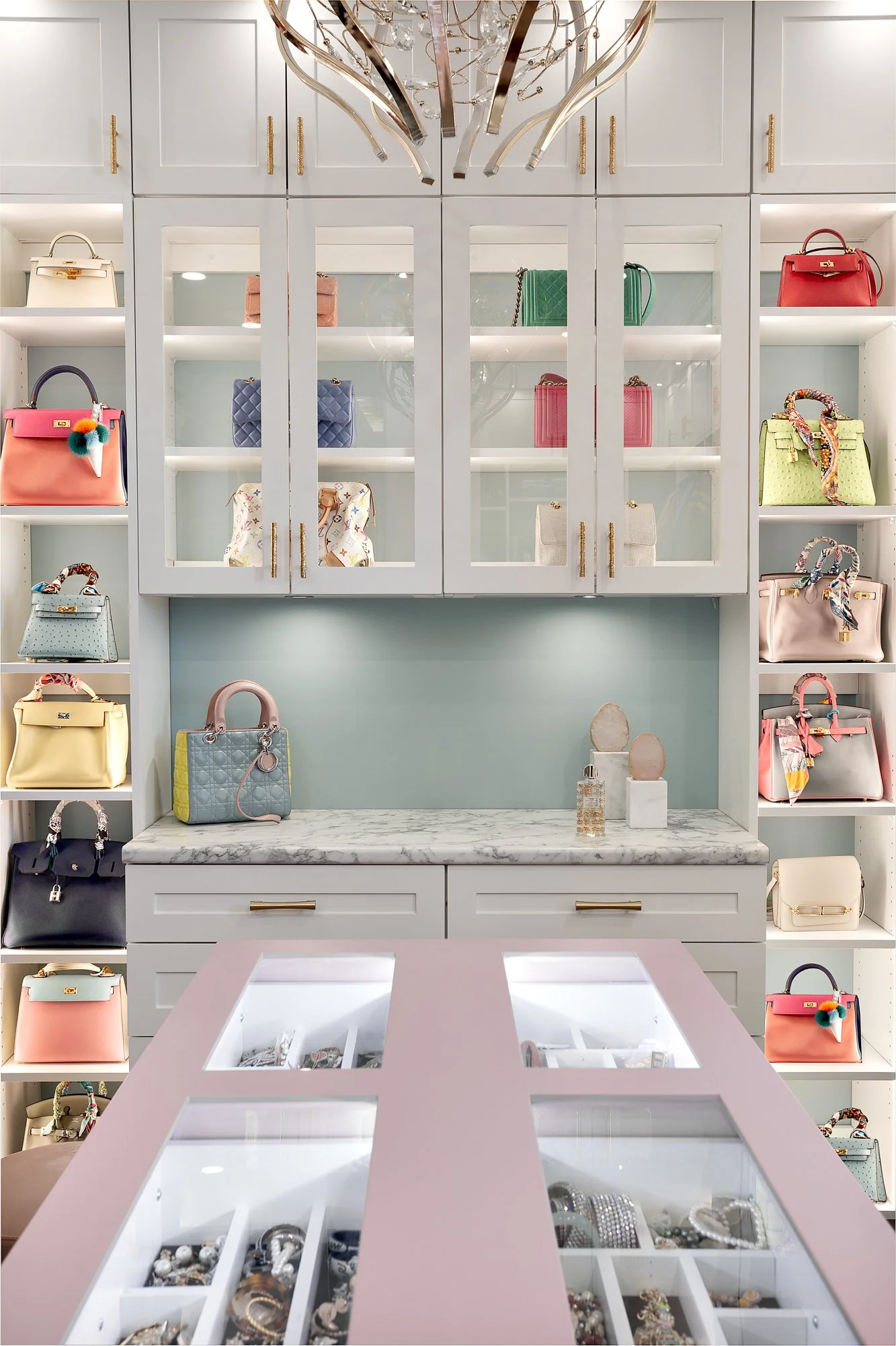 Custom-designed luxury handbag display in a white walk-in closet, showcasing high-efficiency storage solutions in a Vancouver luxury home.